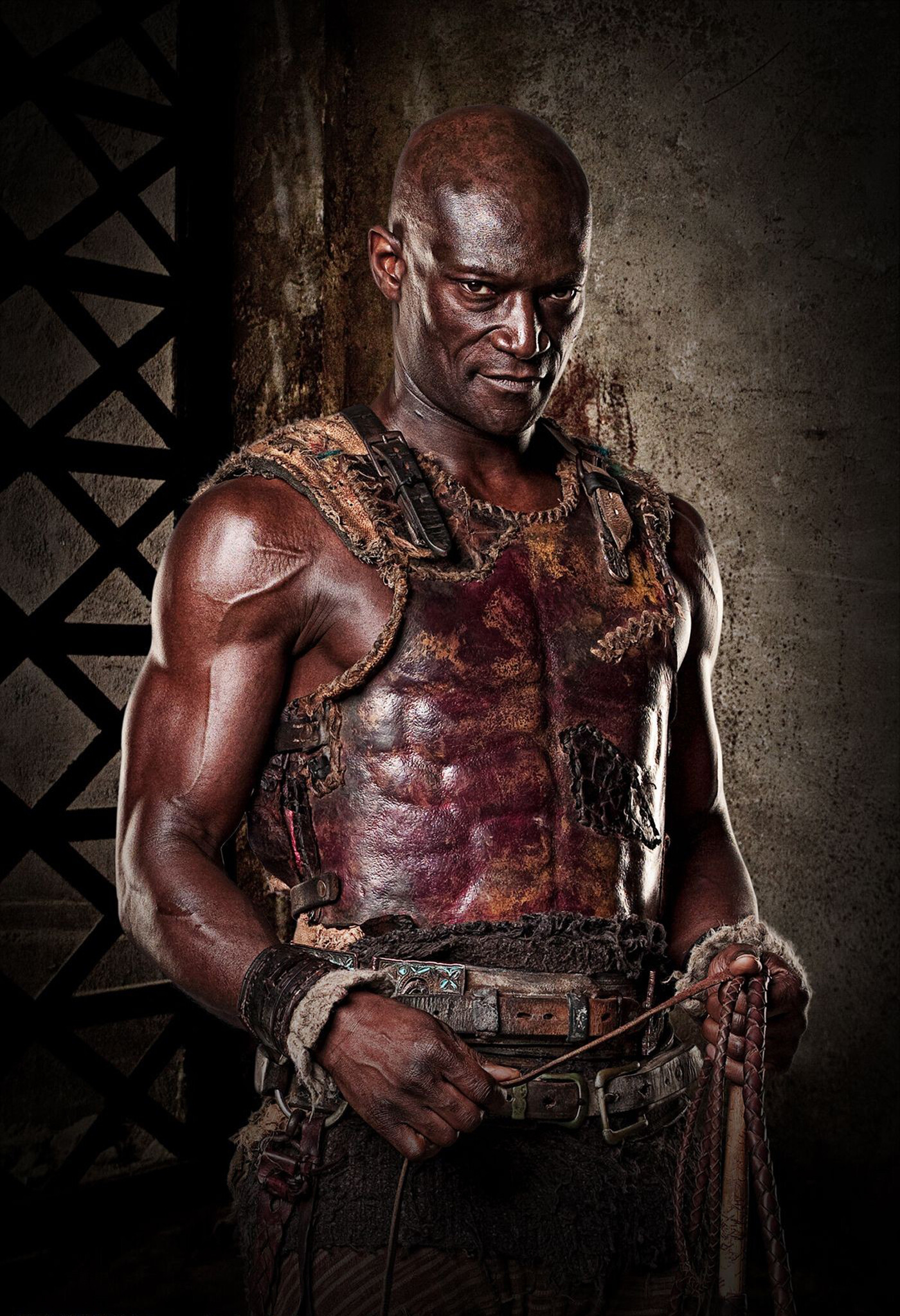 Spartacus: Gods of the Arena: Peter Mensah as Oenomaus/Doctore – a Numidian gladiator. 1400x2050 HD Background.