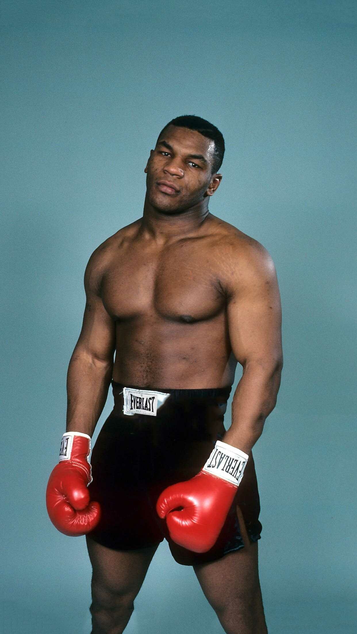 Mike Tyson: He became the first heavyweight to own all three major belts – WBA, WBC, and IBF – at the same time. 1250x2210 HD Wallpaper.