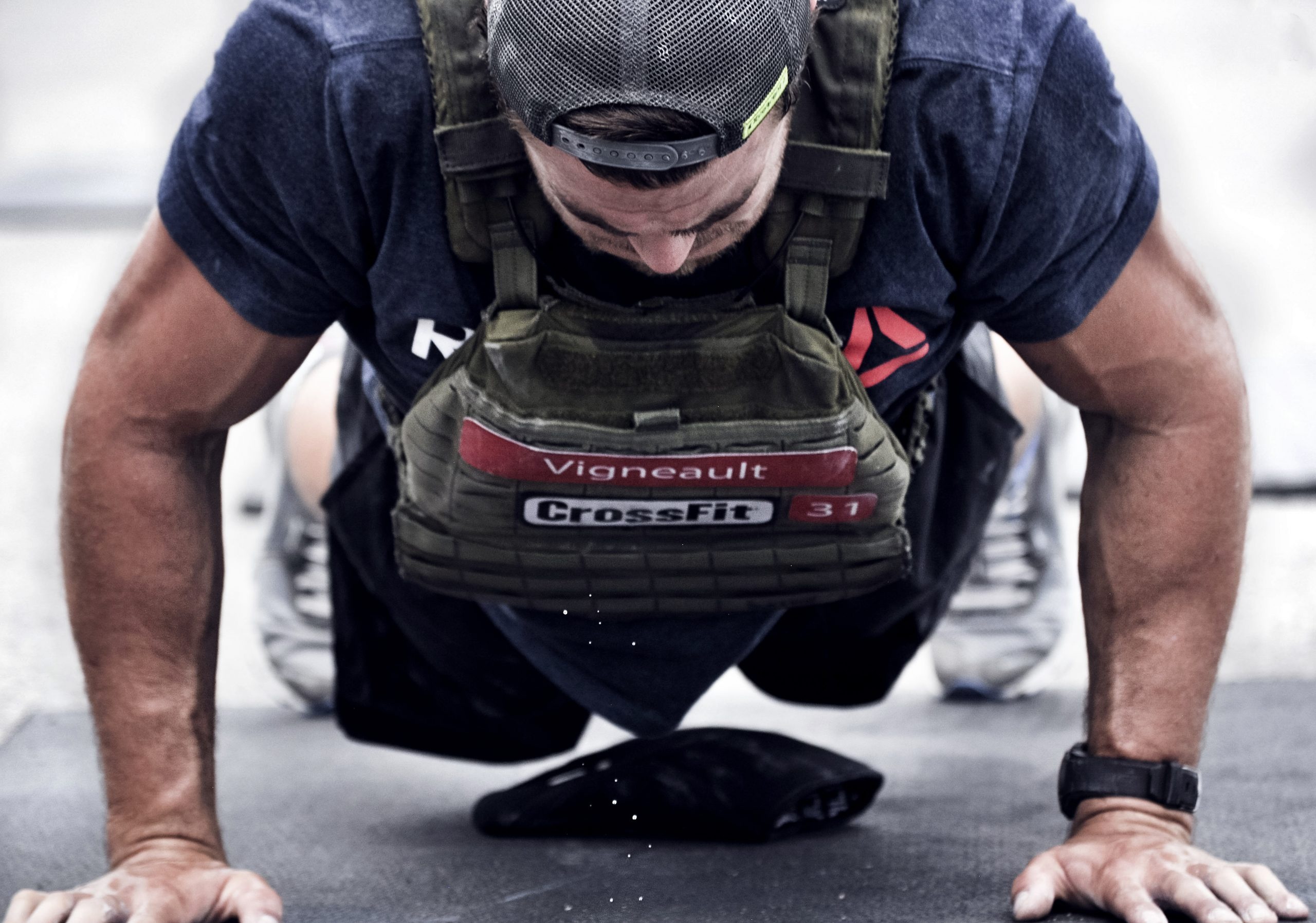 CrossFit: A weighted push-up, An increased level of intensity, Bodyweight exercise, Wearing a weighted vest. 2560x1800 HD Background.
