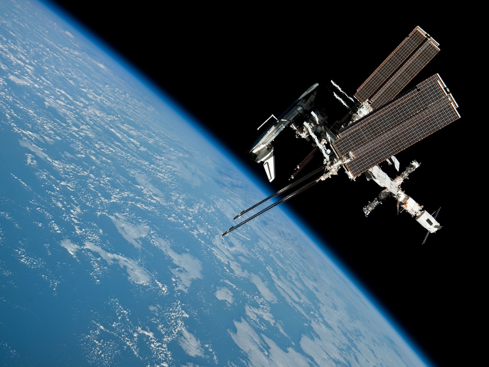 International Space Station: An international laboratory to conduct experiments in the weightless environment of microgravity, NASA. 1920x1440 HD Background.