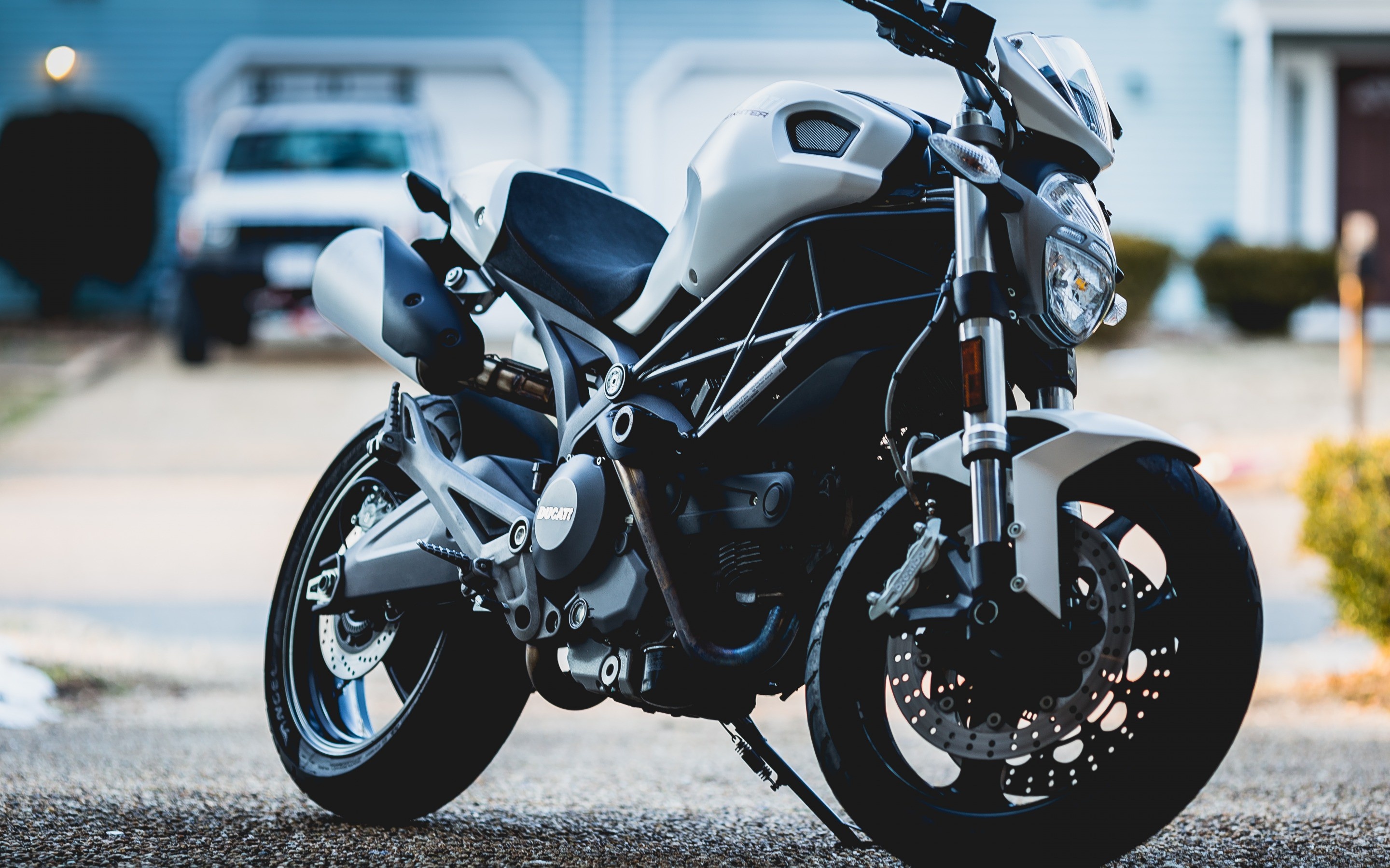 Superbike: A black-and-white Ducati street motorcycle, A popular racing and transportation model. 2880x1800 HD Wallpaper.