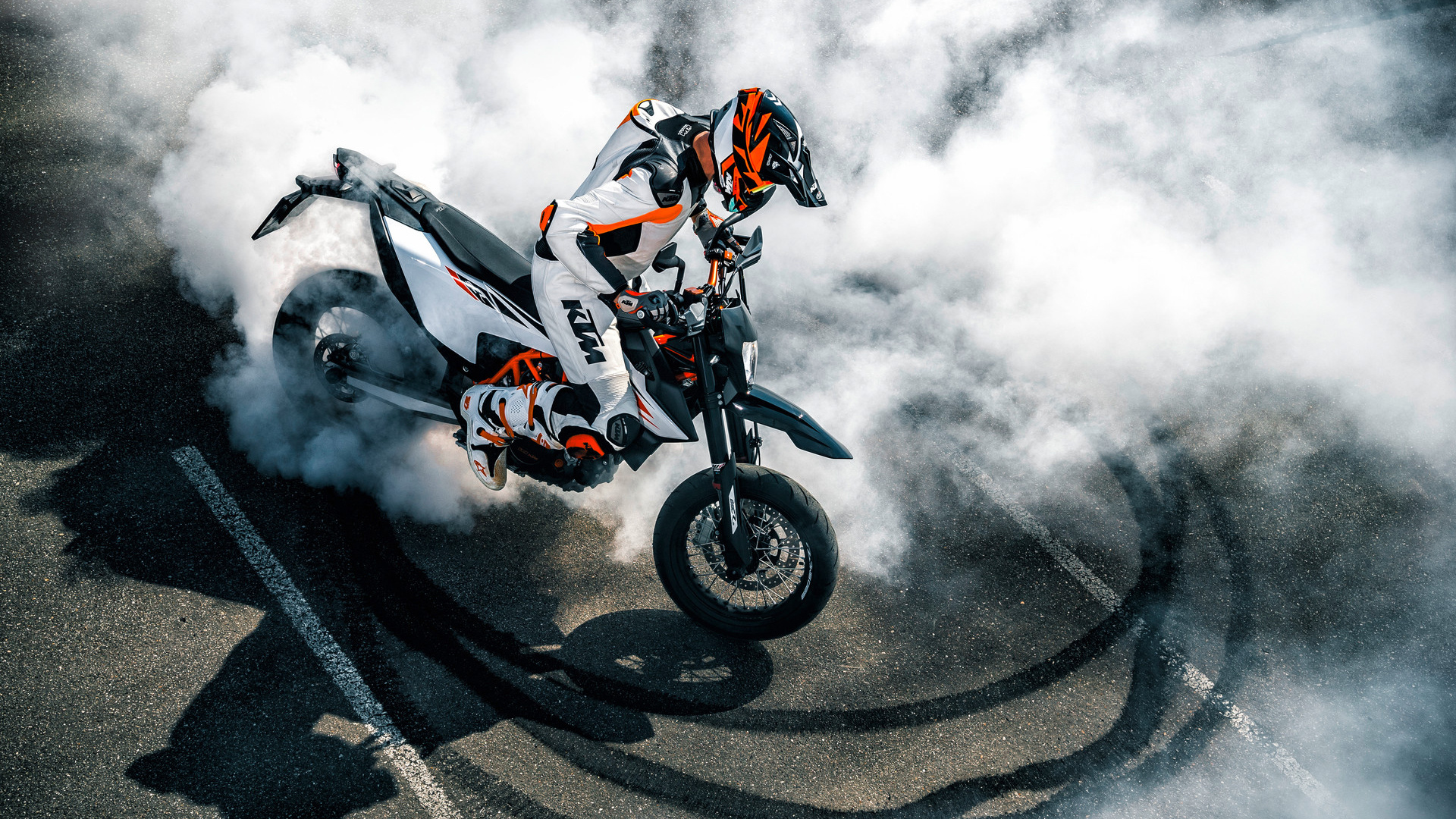 Stunt: KTM 690 Enduro bike, Burnout by a professional stuntman. 1920x1080 Full HD Background.