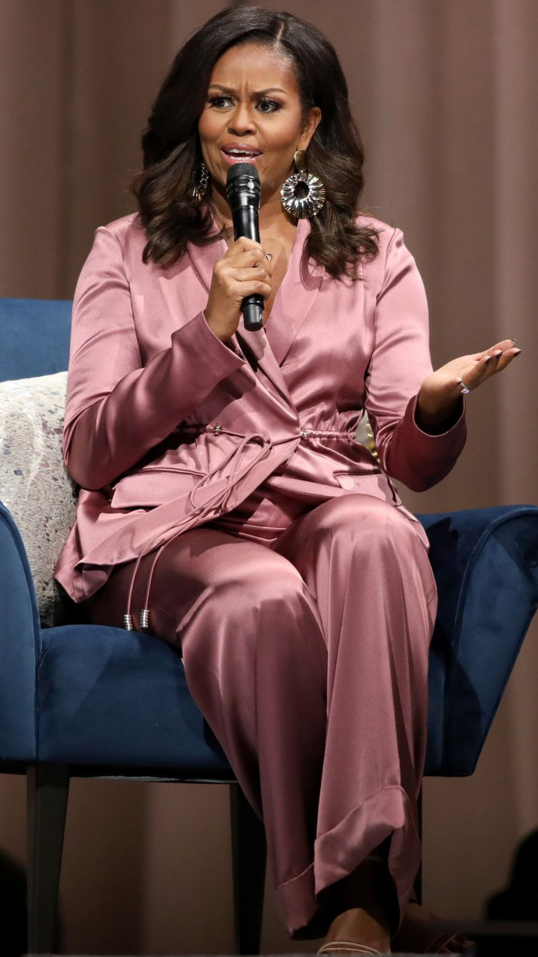 Michelle Obama: The third first lady of the United States to have a post-graduate degree. 1080x1920 Full HD Background.