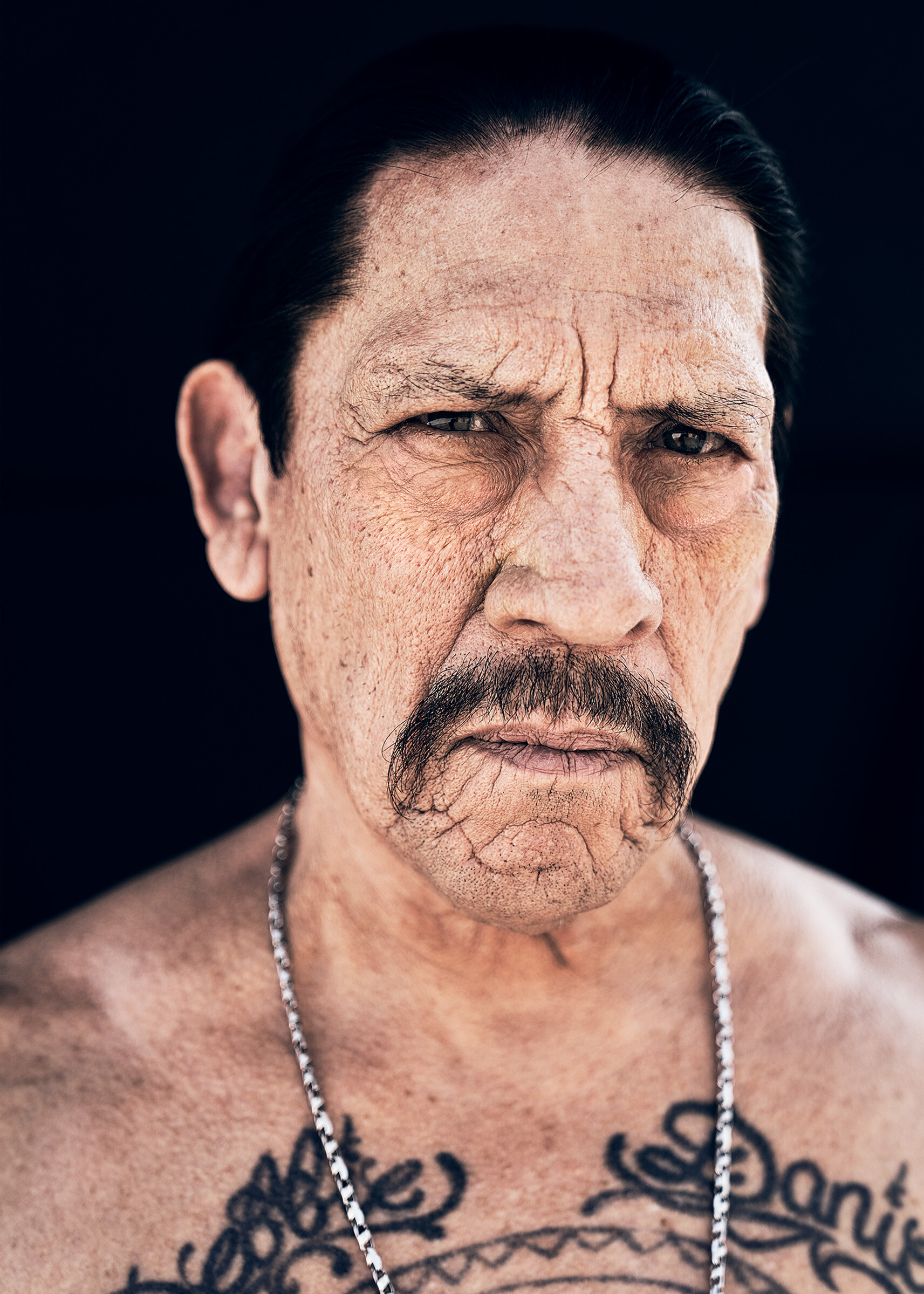 Danny Trejo: A real-life character, Long hair, Trademark mustache, The striking tattoo on his chest, An icon of rudeness. 1720x2400 HD Wallpaper.