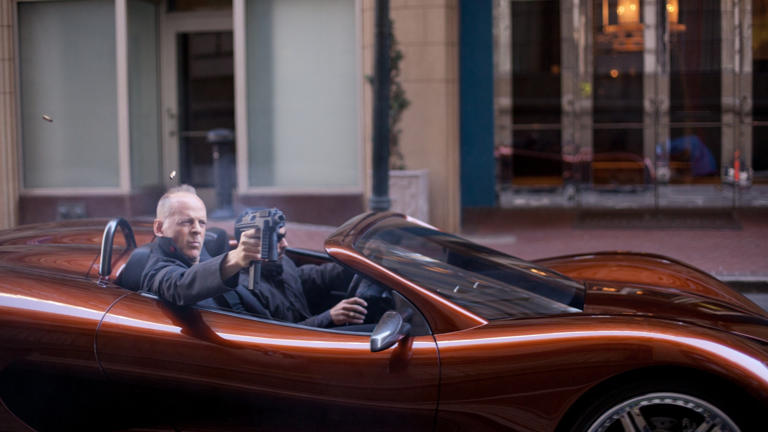 Bruce Willis, Famous actor, Car and gun, Celebrity wallpaper, 2560x1440 HD Desktop