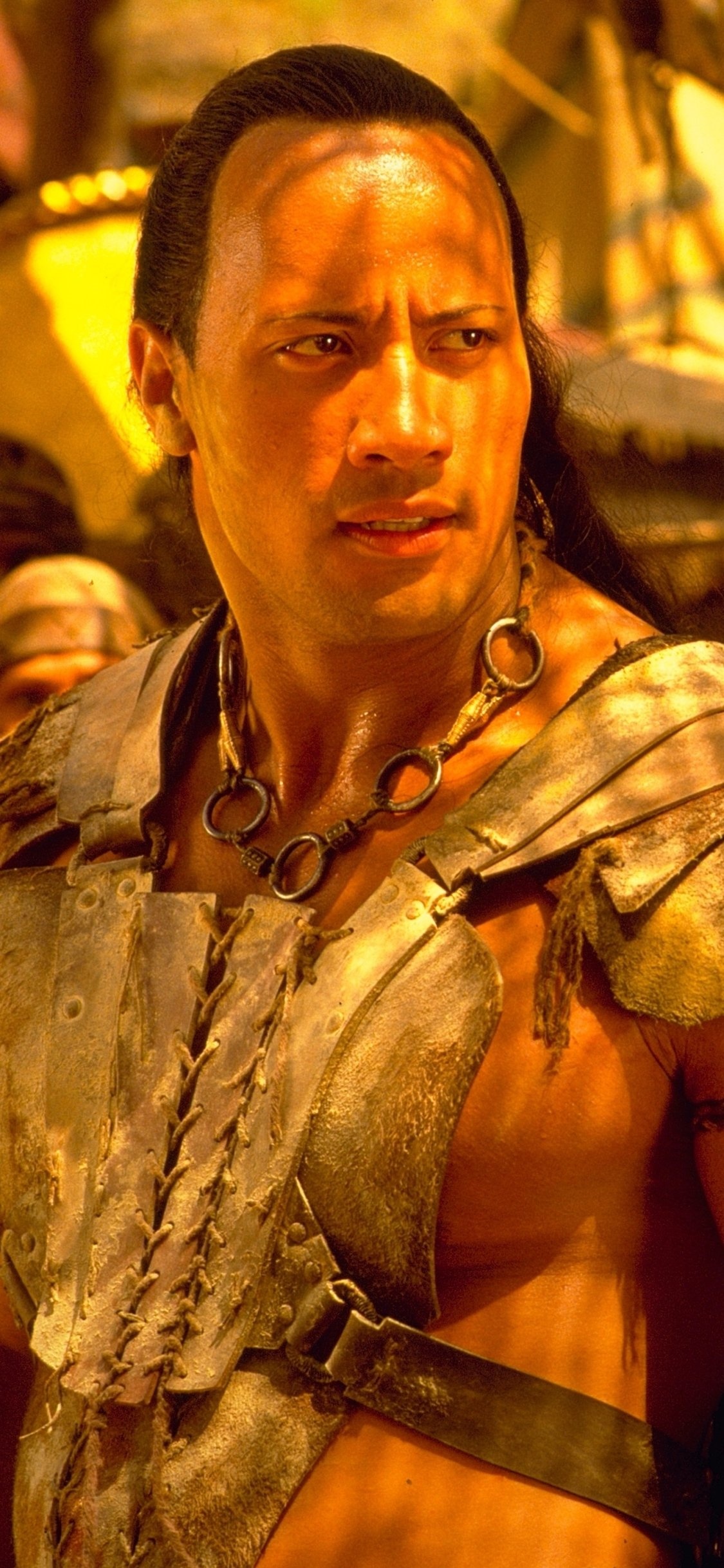 Dwayne Johnson (The Scorpion King): A warrior seeking revenge for his brother's death at the hands of a ruthless king. 1130x2440 HD Background.