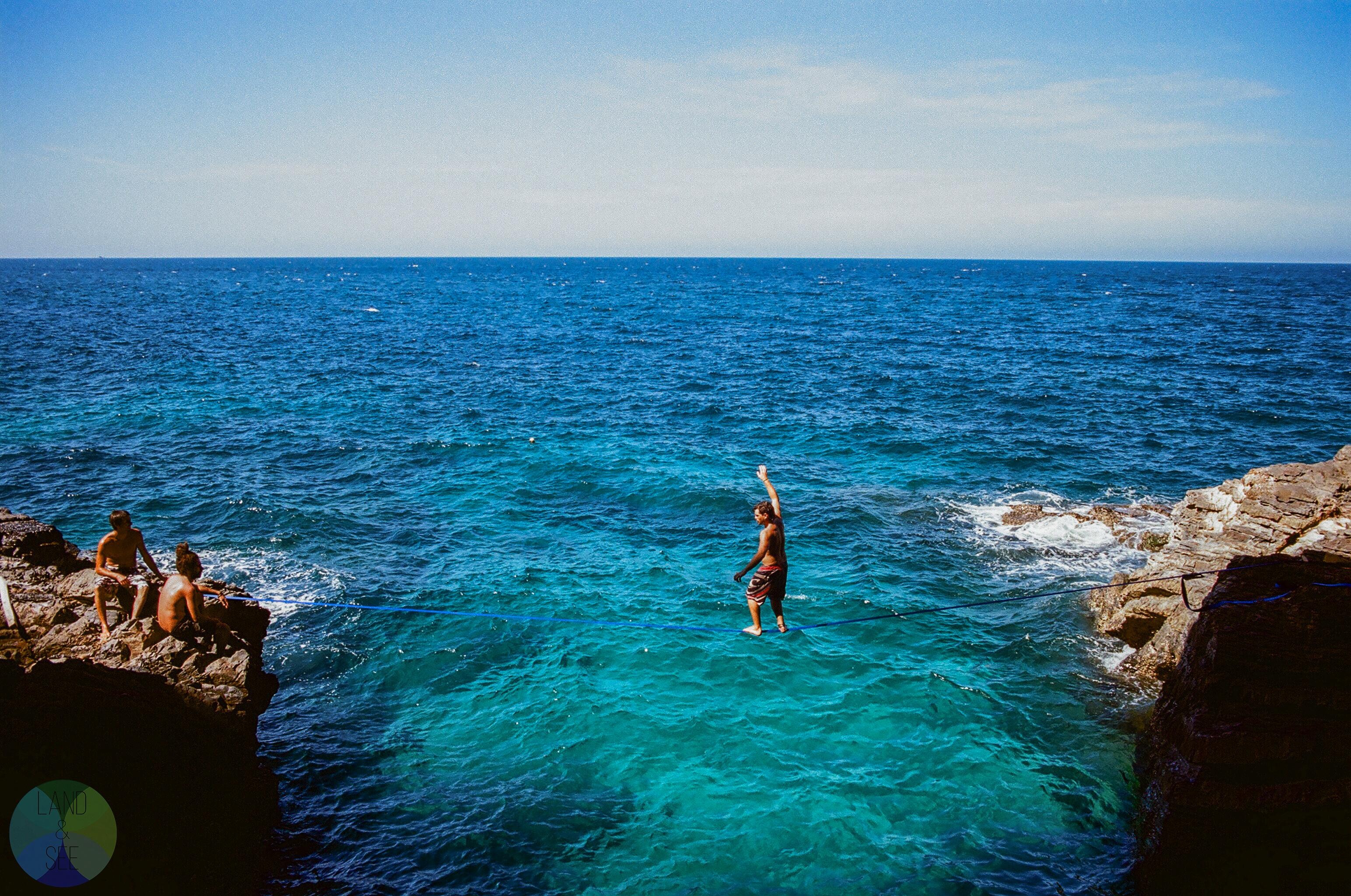 Slacklining: Slacklining over crystal clear blue water, Malaysia, An extreme sport for the daring few. 3090x2050 HD Background.