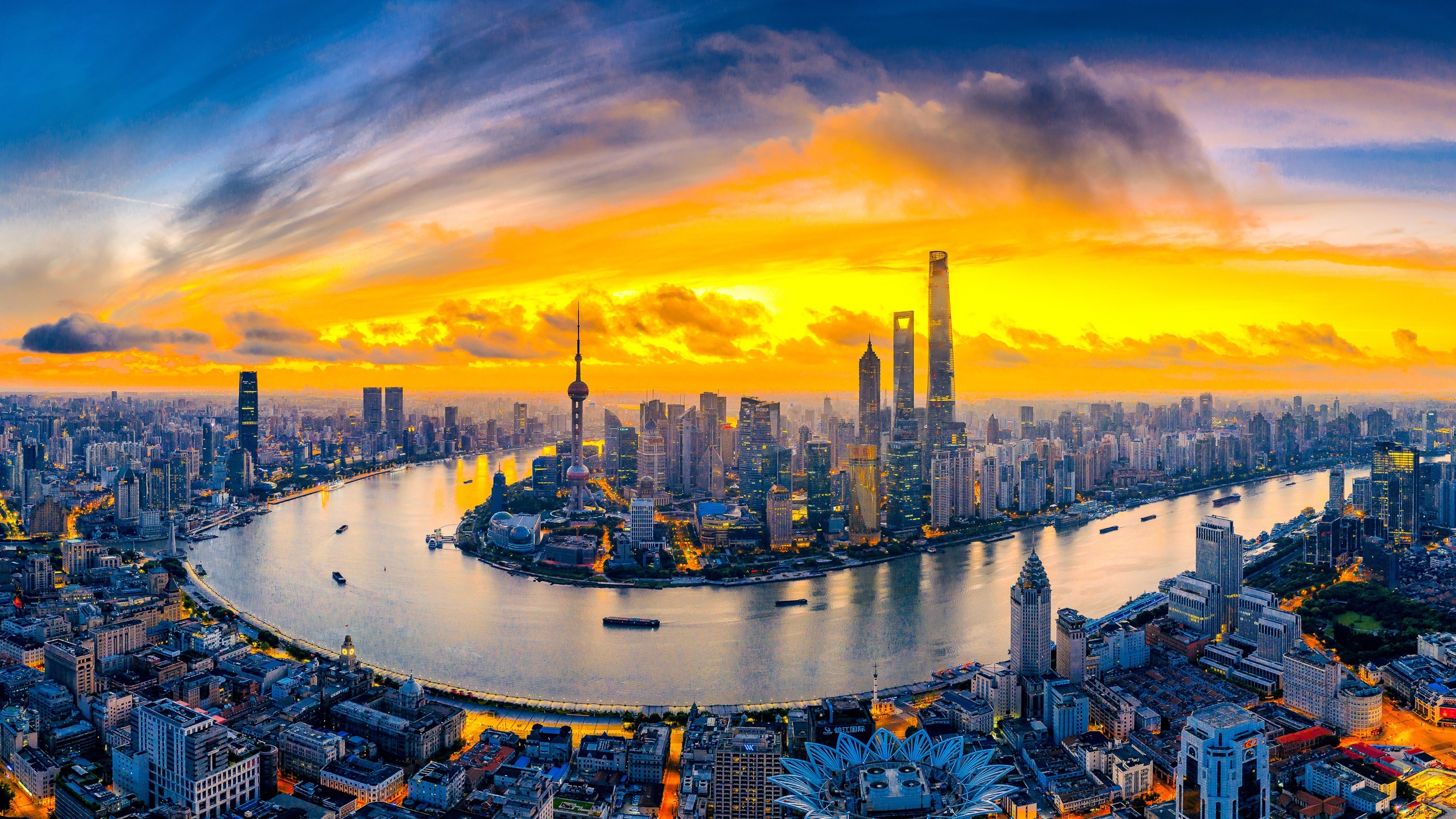 Shanghai Skyline, Sunset over river, Skyscrapers in the distance, Urban cityscape, 2560x1440 HD Desktop
