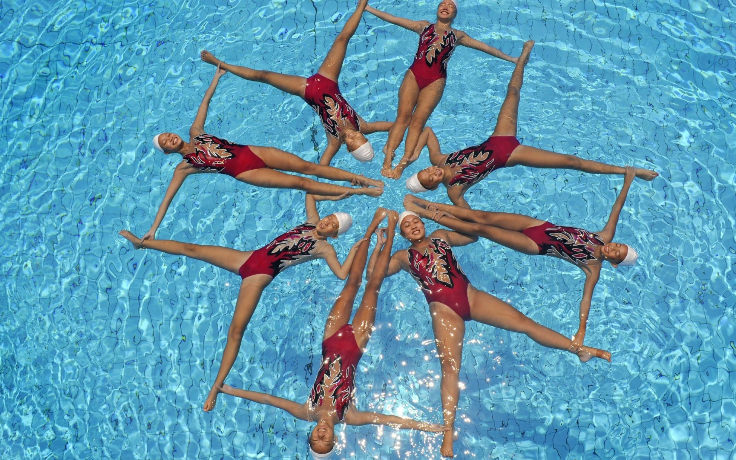 Synchronized Swimming: Artistic techniques and basic sculls training session, Water sports discipline. 2560x1600 HD Background.
