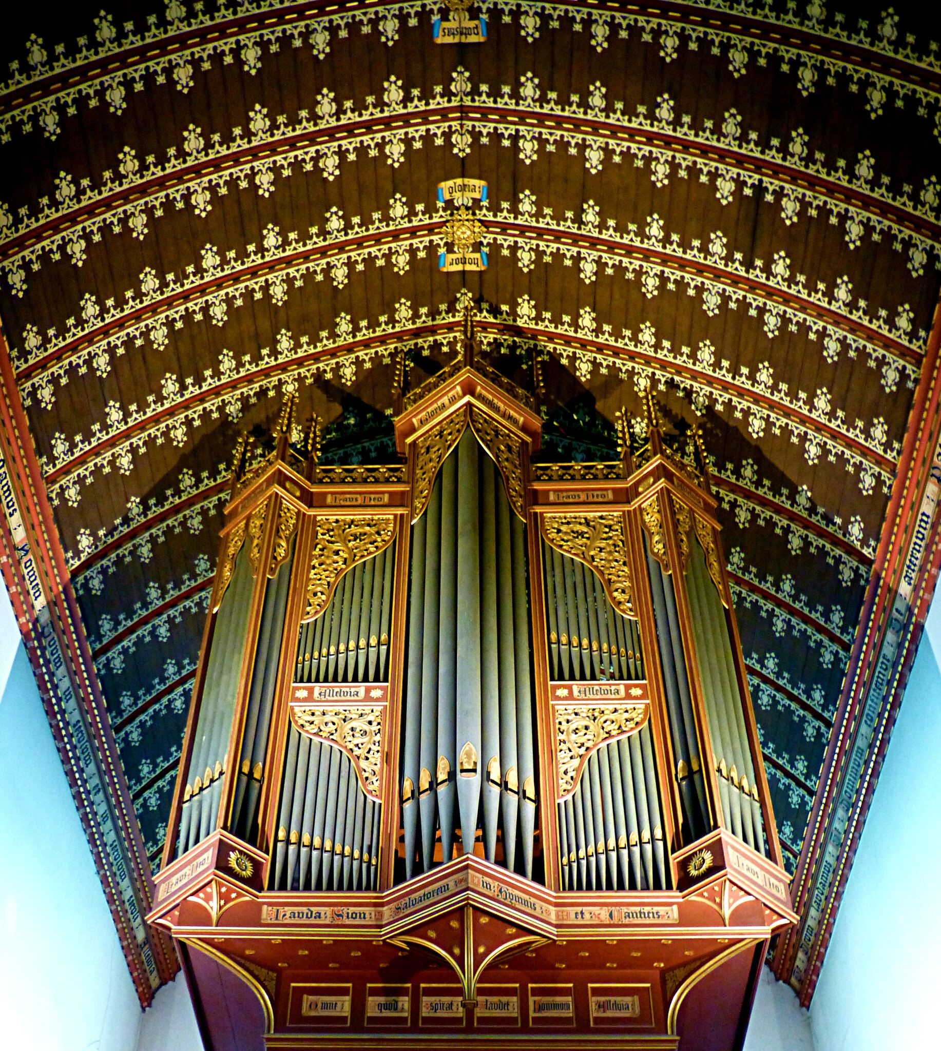 Pipe Organ: A musical instrument with sets of tubes actuated by keyboard and sounded by compressed air. 1840x2050 HD Background.
