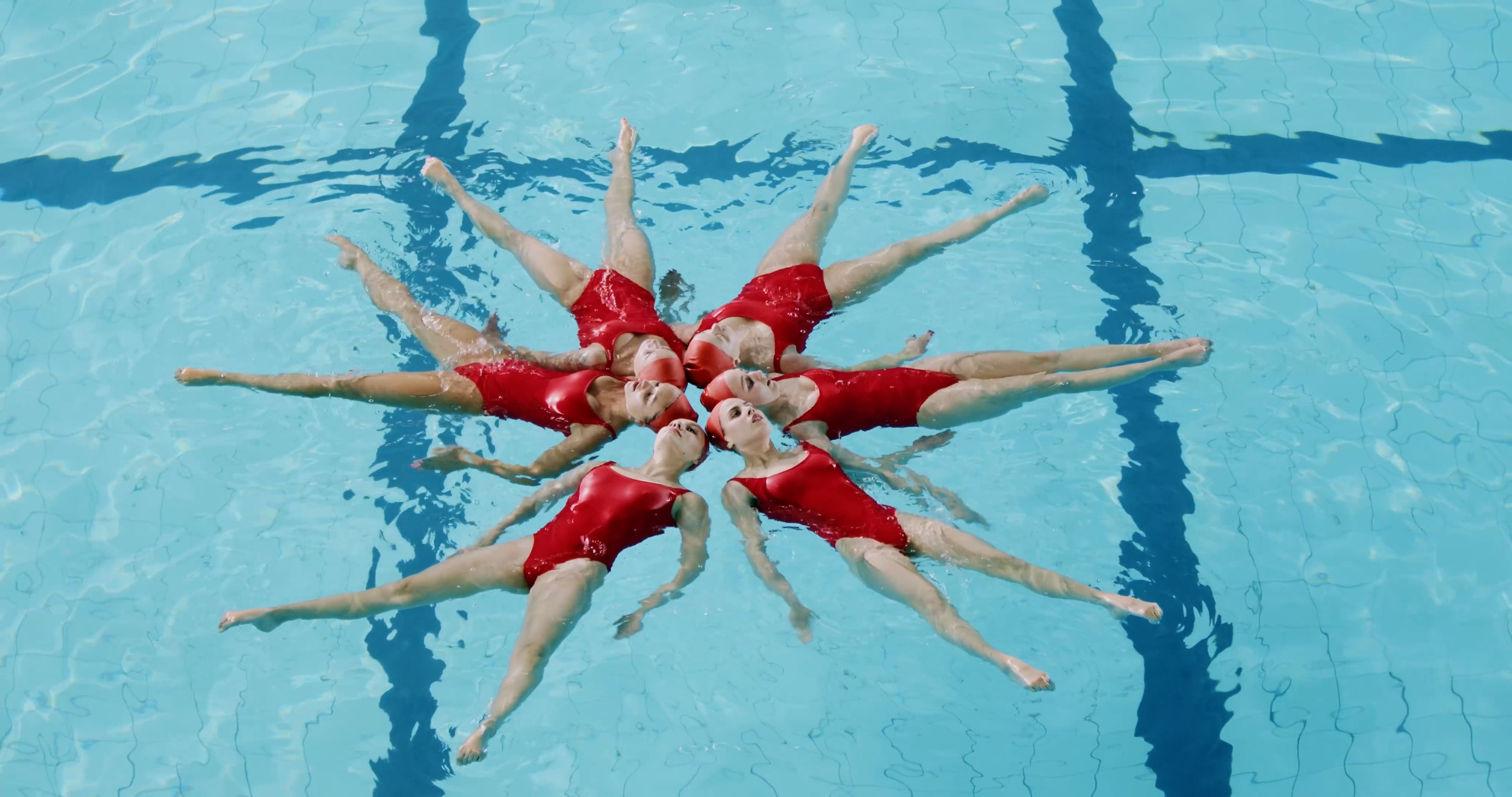 Synchronized Swimming: A competitive water sport where swimmers perform a synchronized choreographed routine, accompanied by music. 3840x2030 HD Wallpaper.