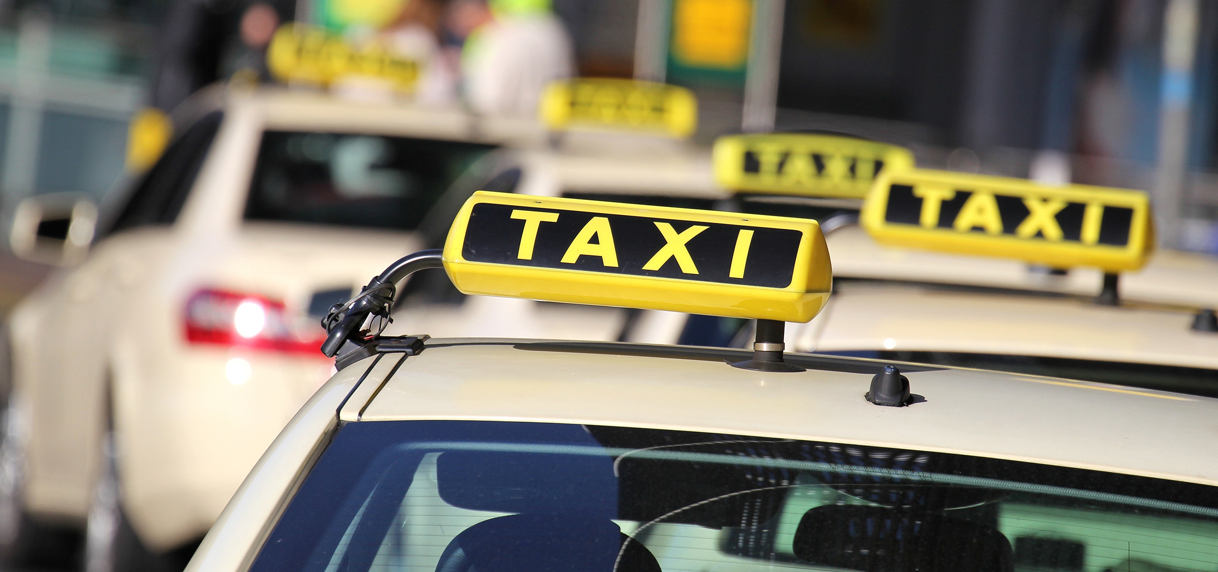 Taxi: A luminous taxicab top sign, A door-to-door automotive delivery service. 2400x1130 Dual Screen Wallpaper.