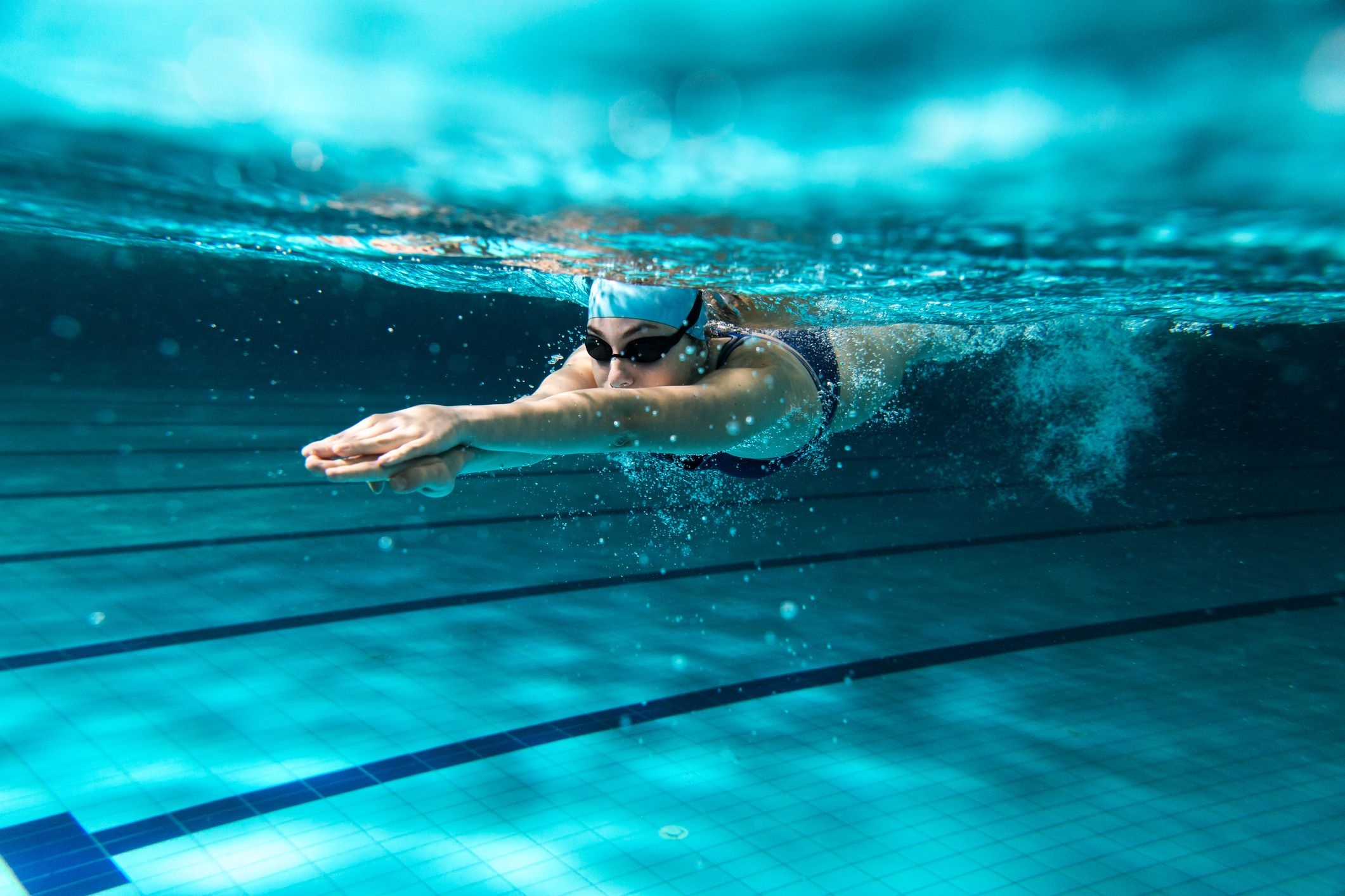 Swimming: Underwater moment of a front crawl style of moving over the water. 2130x1420 HD Wallpaper.