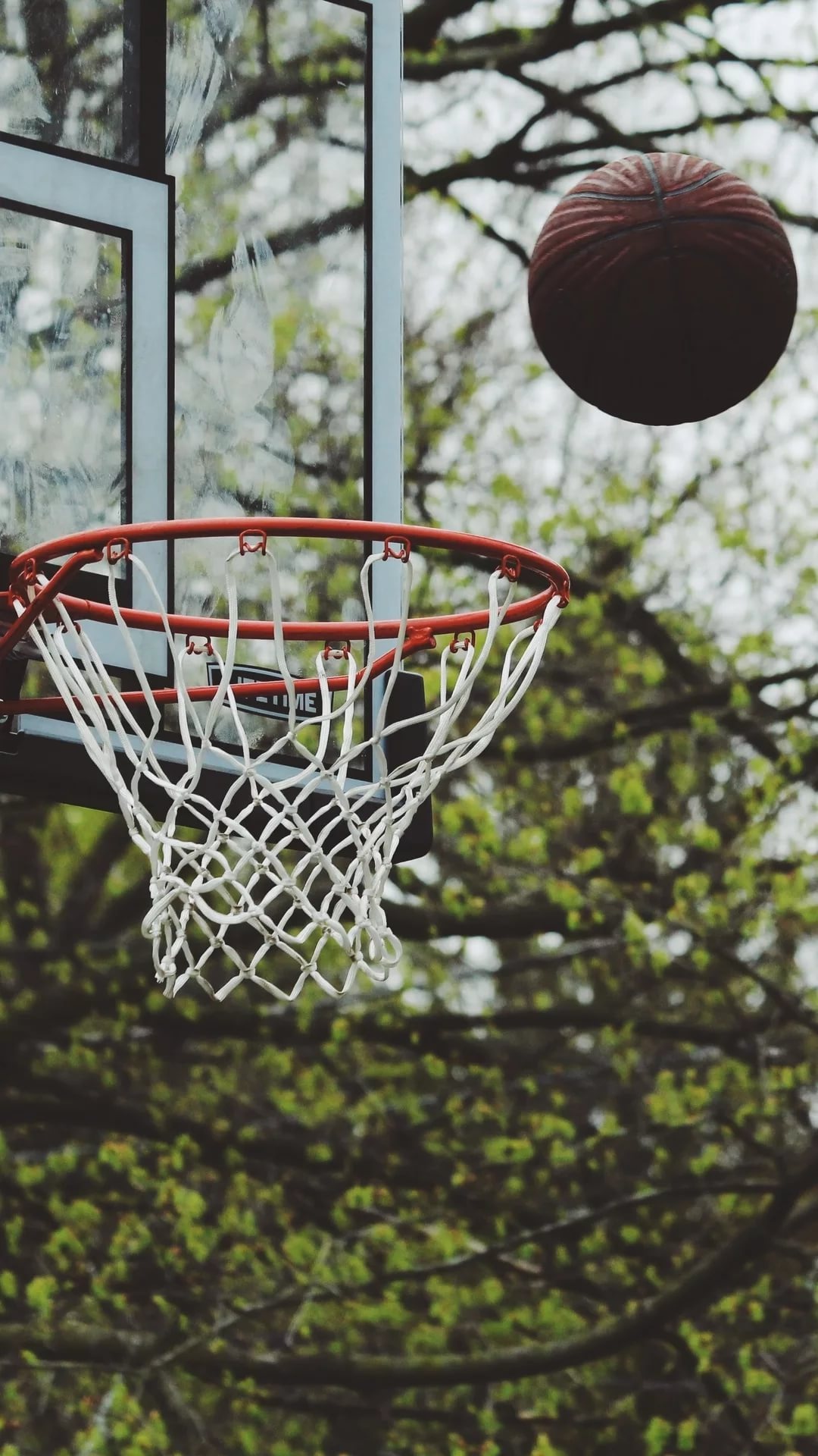 Streetball: Street basketball, A variation of basketball, typically played on outdoor courts. 1080x1920 Full HD Background.