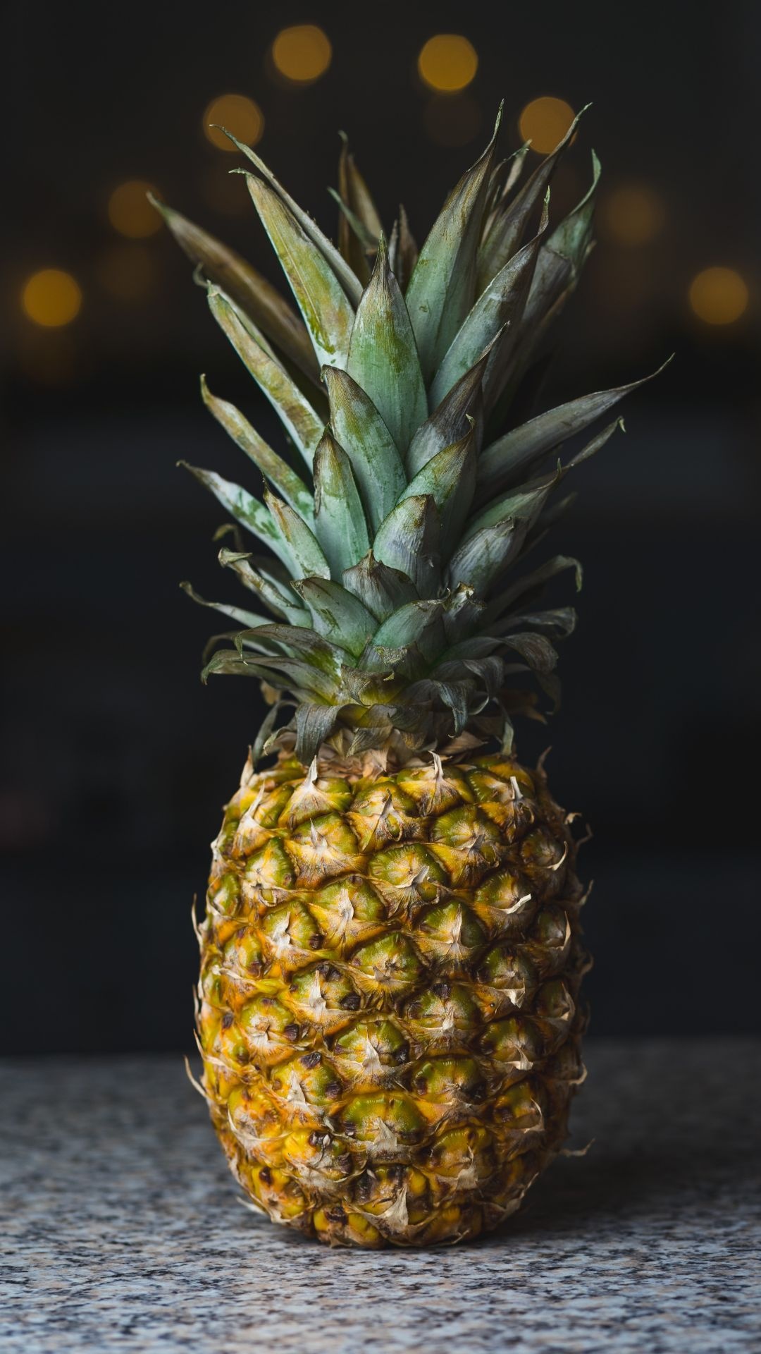 Pineapple: A large tropical fruit with a spiky, tough skin and sweet insides. 1080x1920 Full HD Background.