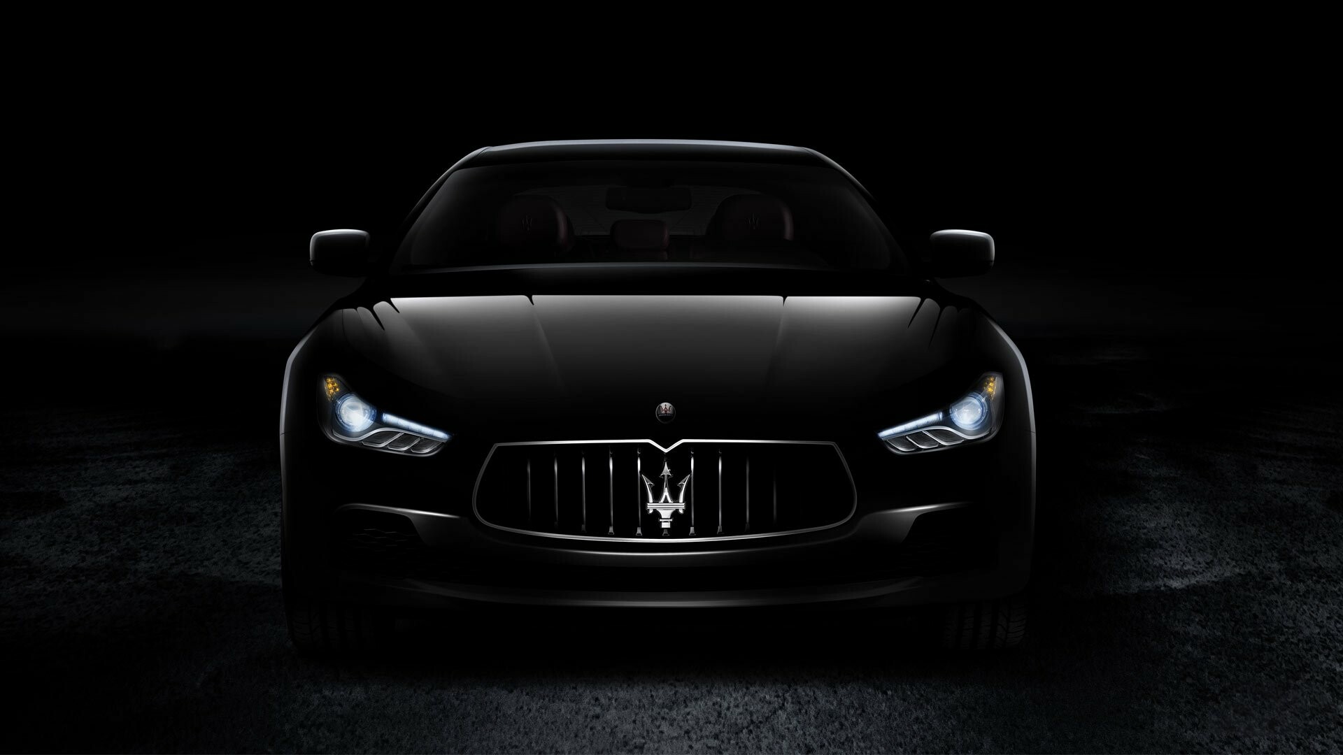Maserati: Its unique brand of dramatic designs and intoxicating performance still proliferates throughout its small lineup, Italian carmaker. 1920x1080 Full HD Background.