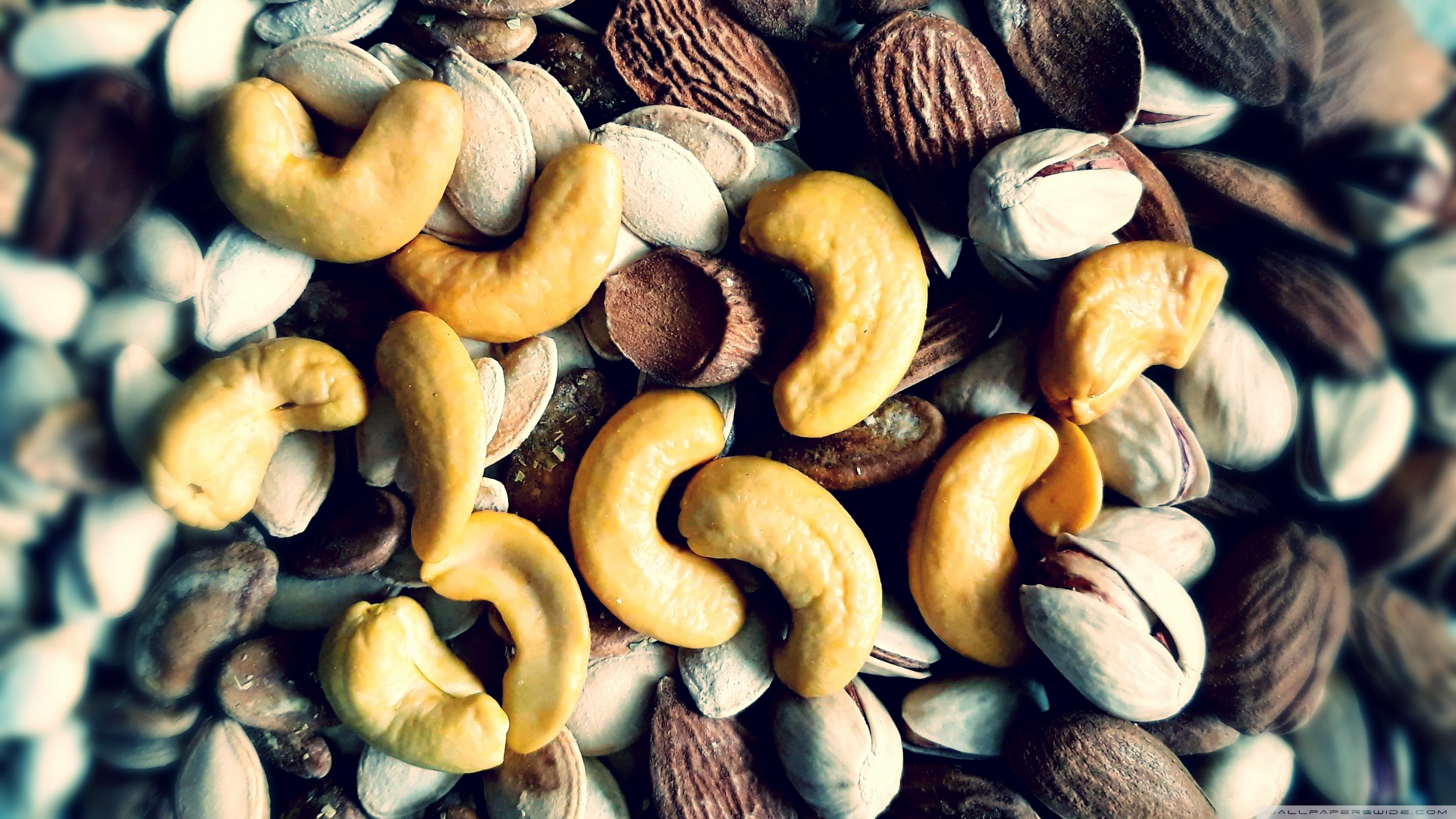 Cashew Nuts: Nuts, Fruits consisting of a hard or tough shell around an edible kernel. 2880x1620 HD Background.