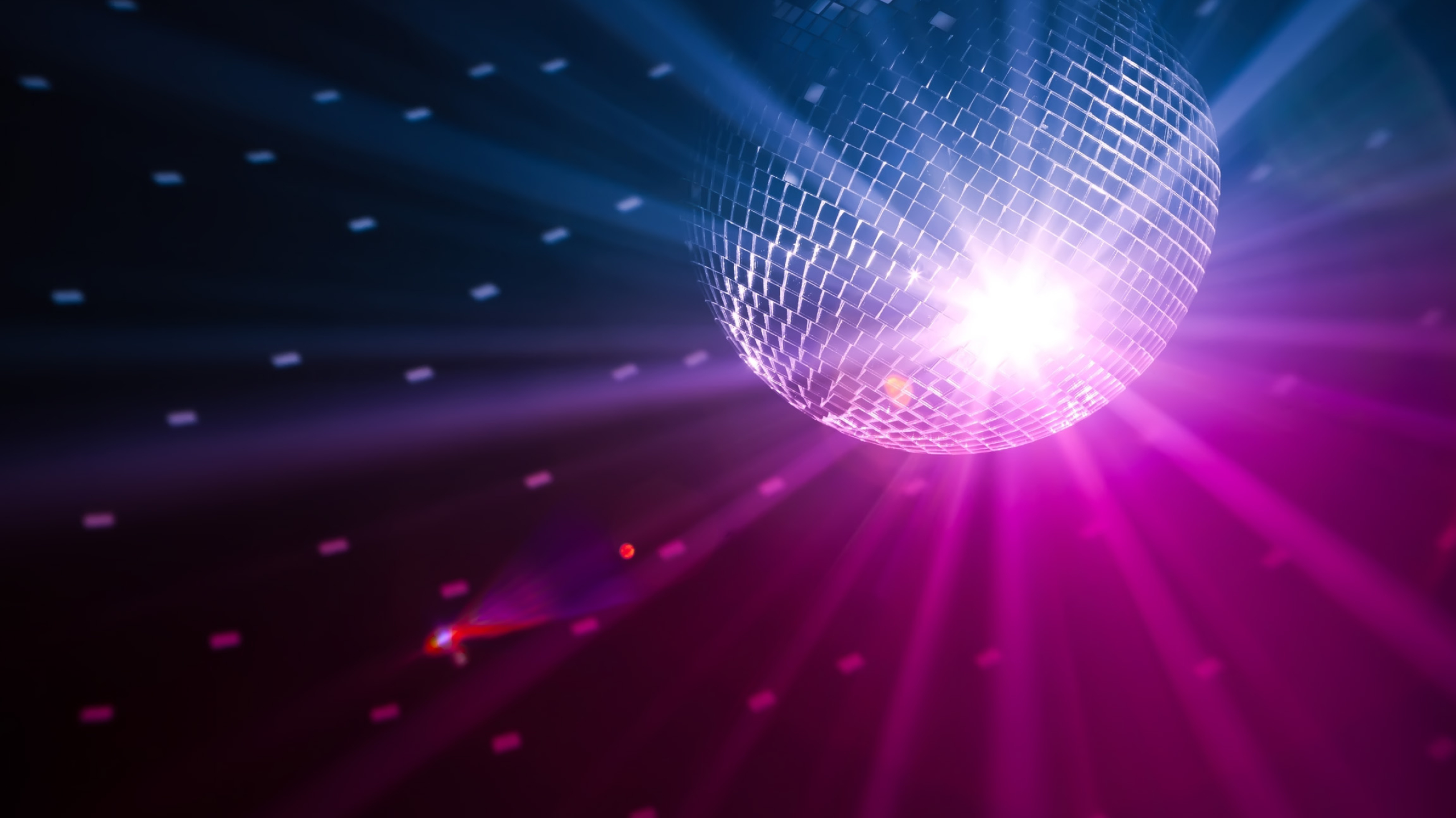 Discotheque: Rainbow glittering mirror ball, Casting moving spots of light, Nightclub. 2560x1440 HD Background.