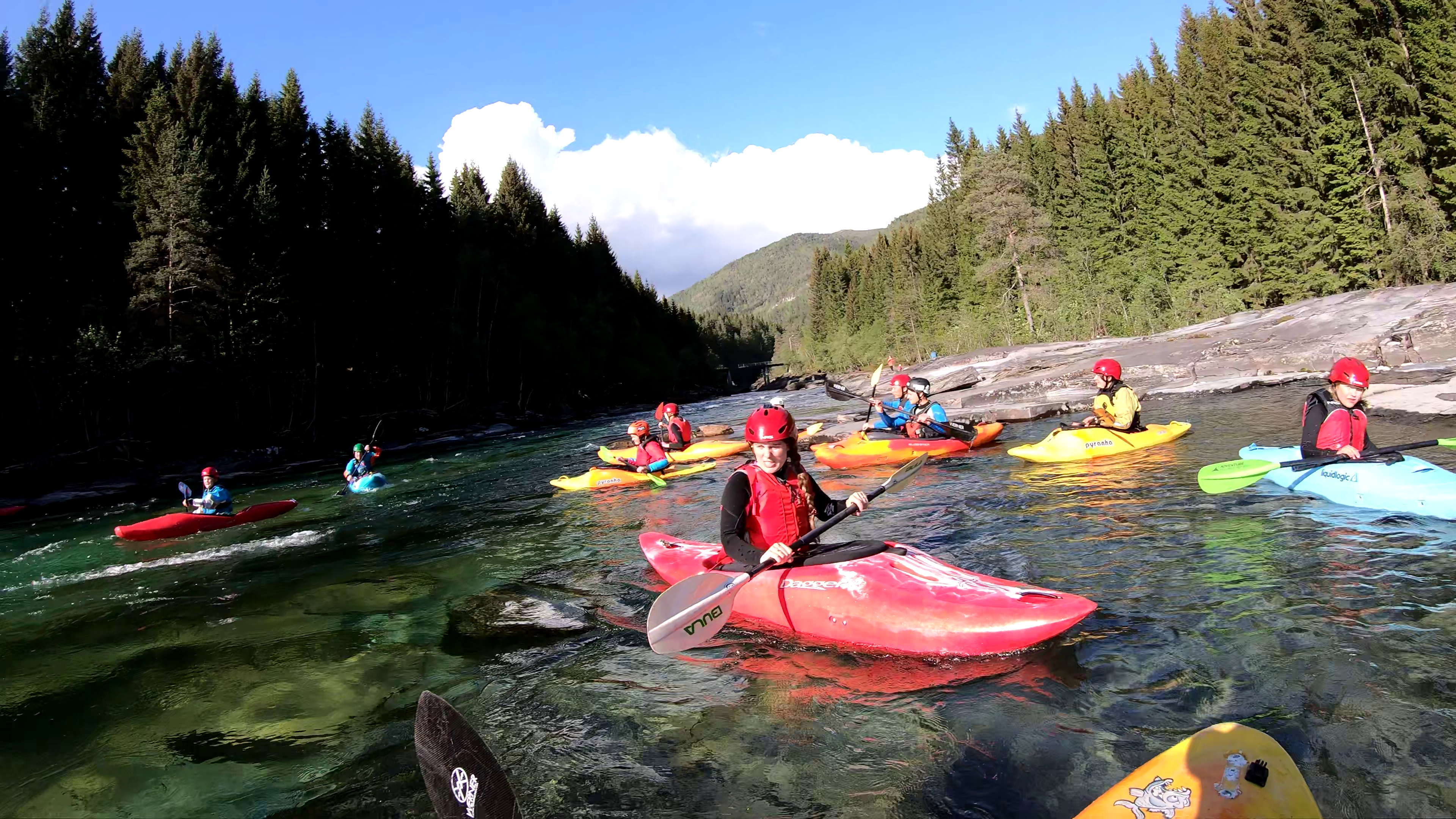 Kayaking: A group uses kayaks to move over the river, Extended water trip. 3840x2160 4K Background.