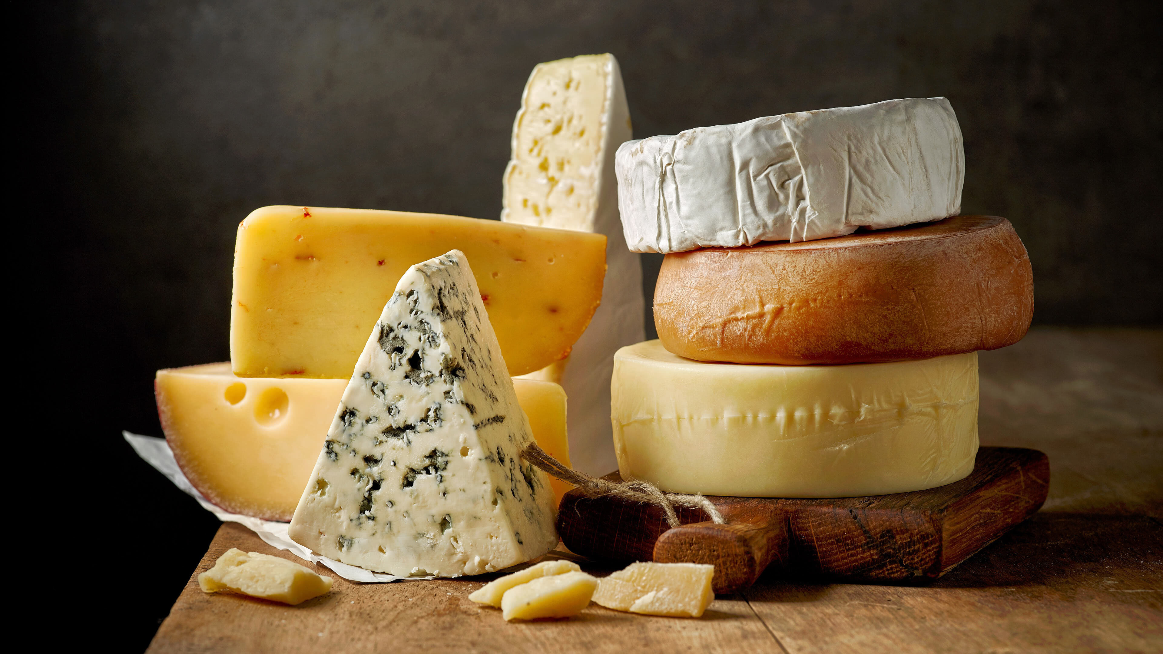 Cheese: A dairy product in wide ranges of flavors, textures, and forms. 3840x2160 4K Wallpaper.