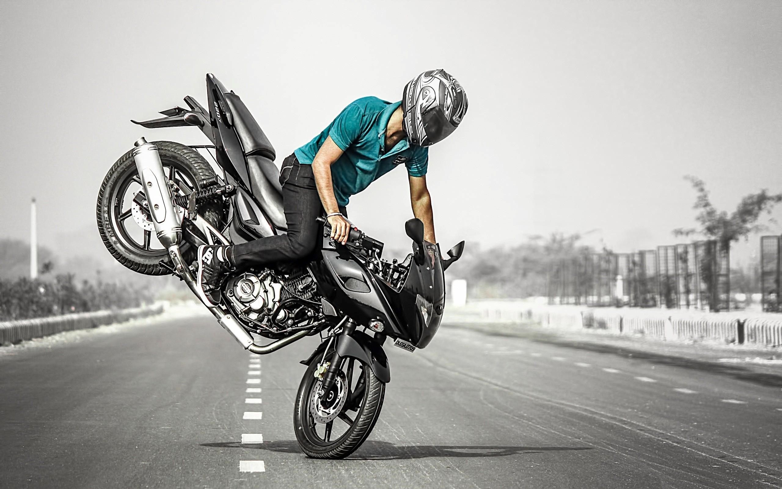 Stunt: Stoppie by a stuntman, Acrobatic maneuvering of the motorcycle. 2560x1600 HD Background.