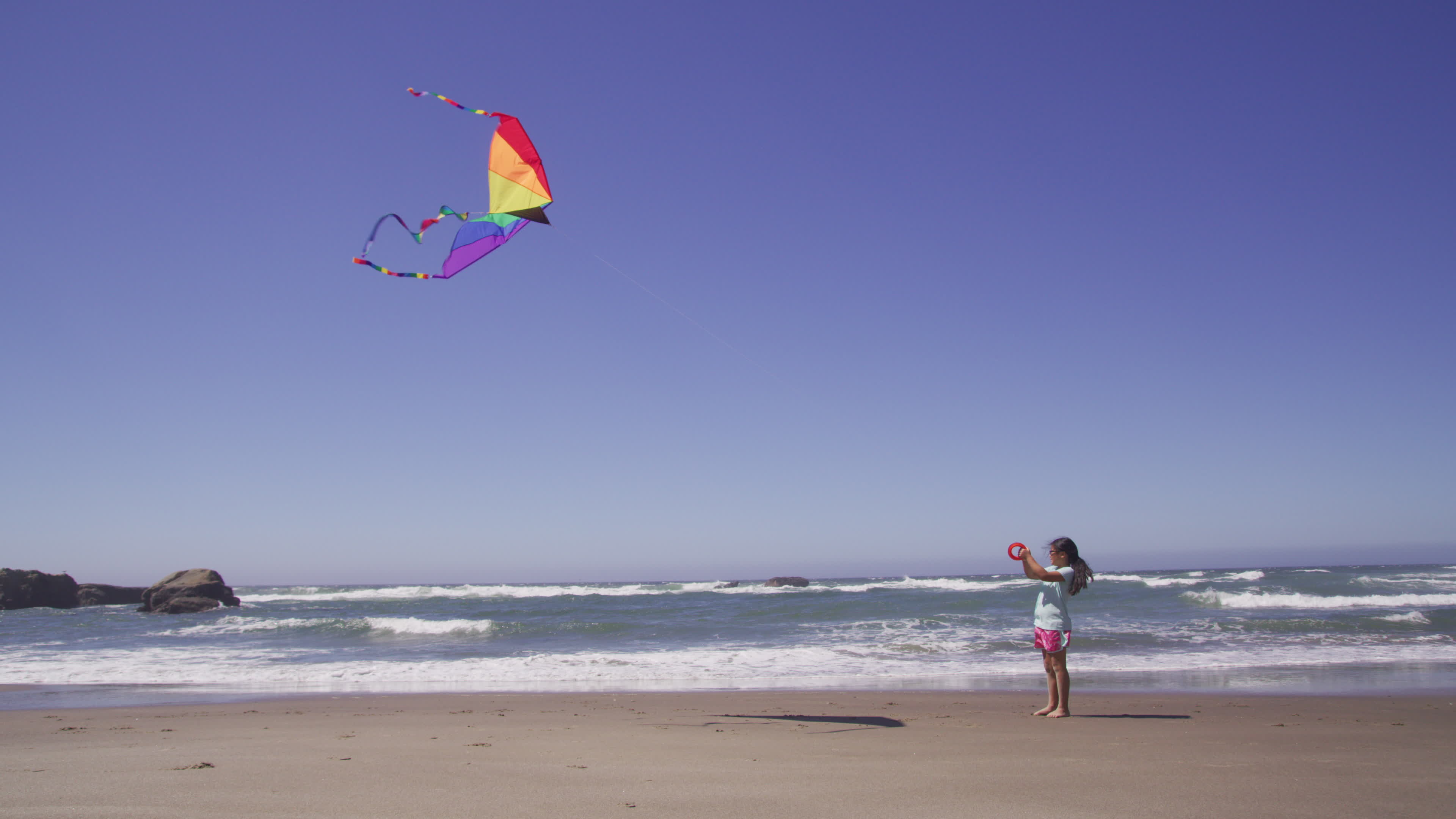 Kite Sports: Flying a kite at the beach, Trinagle shape, Lightweight ripstop nylon. 3840x2160 4K Background.