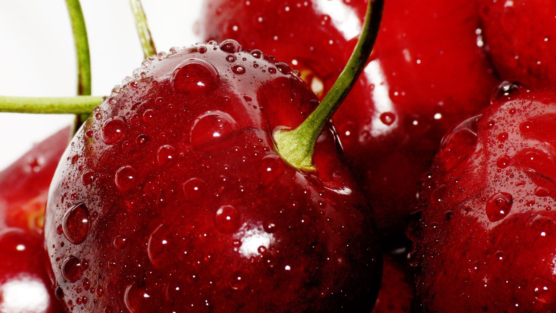 Cherry: Red fruits known as drupes, containing a single seed. 1920x1080 Full HD Background.