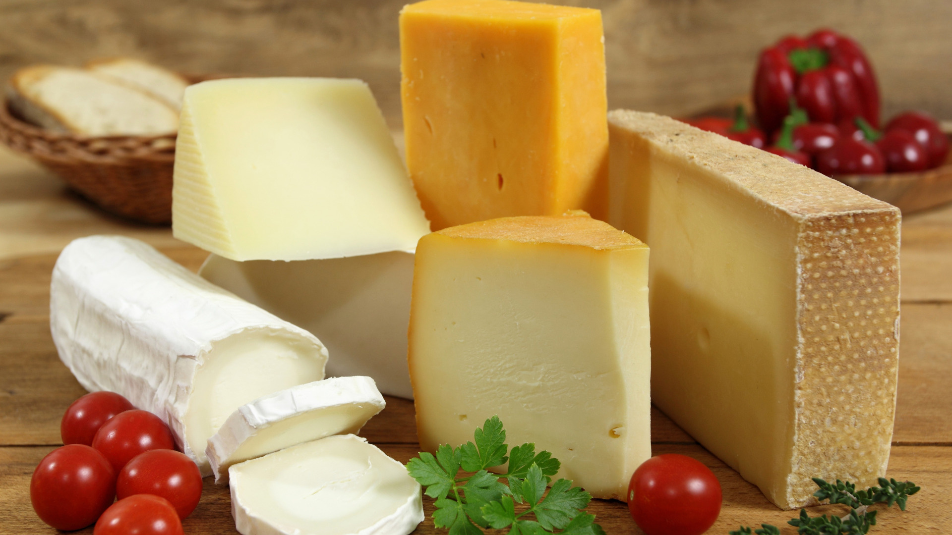Cheese: The texture can range from soft and spreadable to hard and crumbly. 1920x1080 Full HD Background.