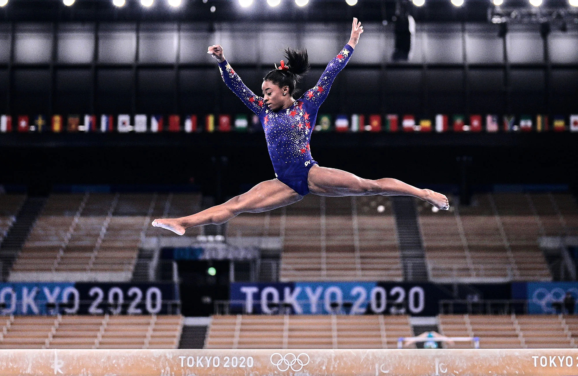 Balance Beam: Simone Biles, The 2018 Artistic Gymnastics World Championships gold medalist, Tokyo 2020. 2000x1310 HD Background.