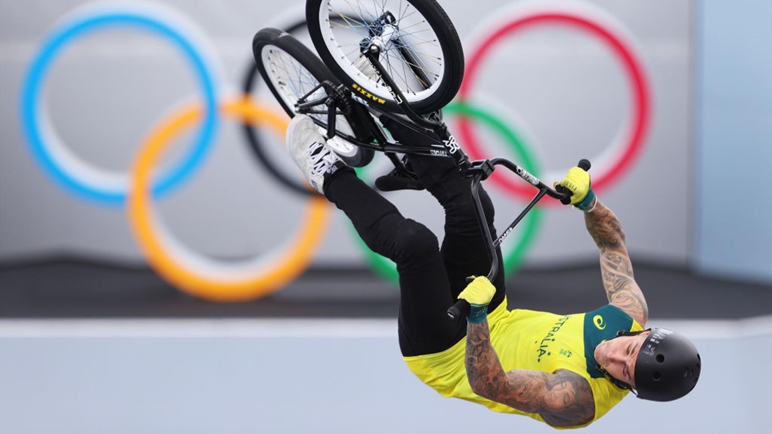 BMX (Sports): Logan Martin At The Olympics Freestyle BMX Debut, Trick On The Two Wheels Of A Bike, Japan, 2020-2021. 2560x1440 HD Background.