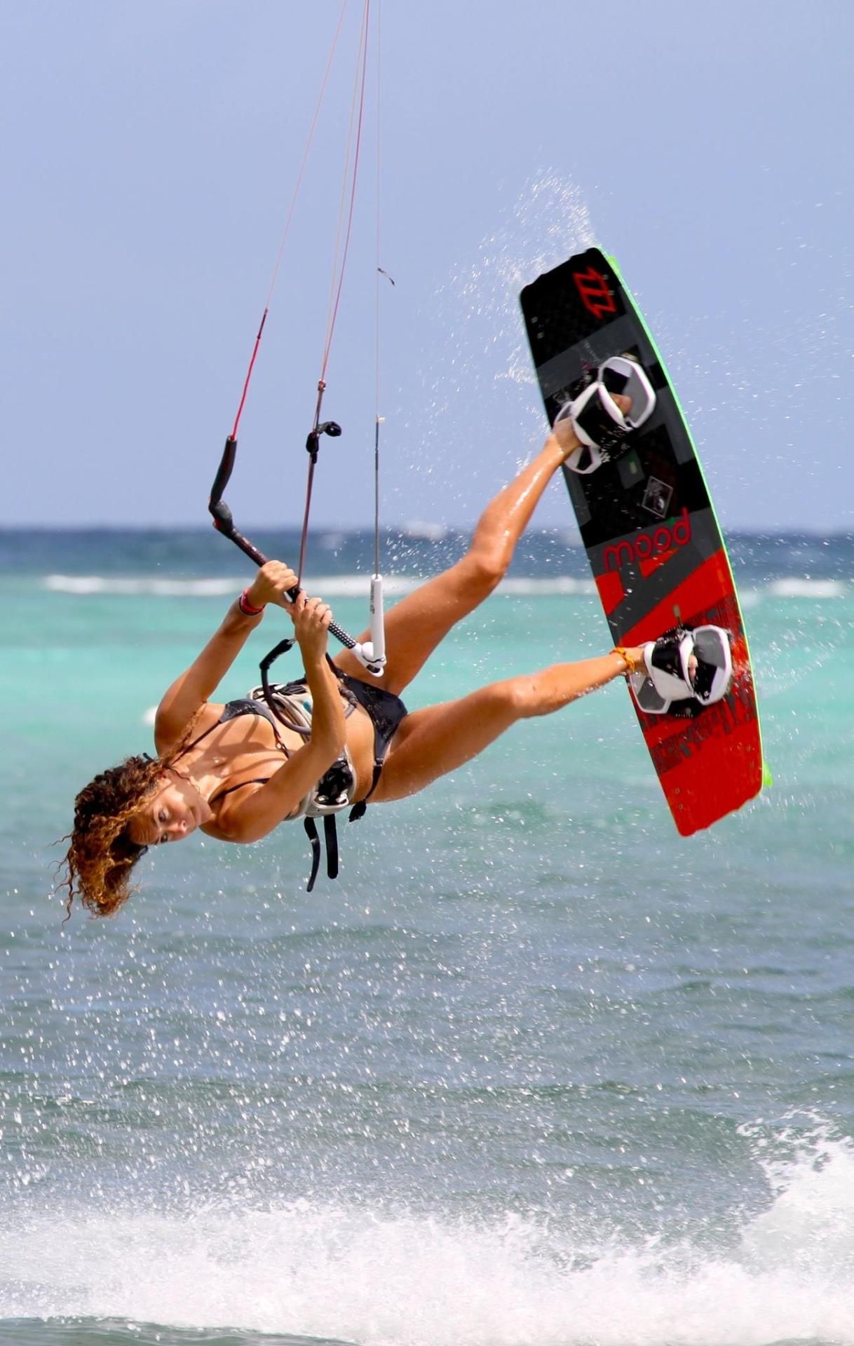 Wakeboarding: Ocean shore recreational water sports, Riding a wakeboard for pleasure. 1220x1920 HD Background.