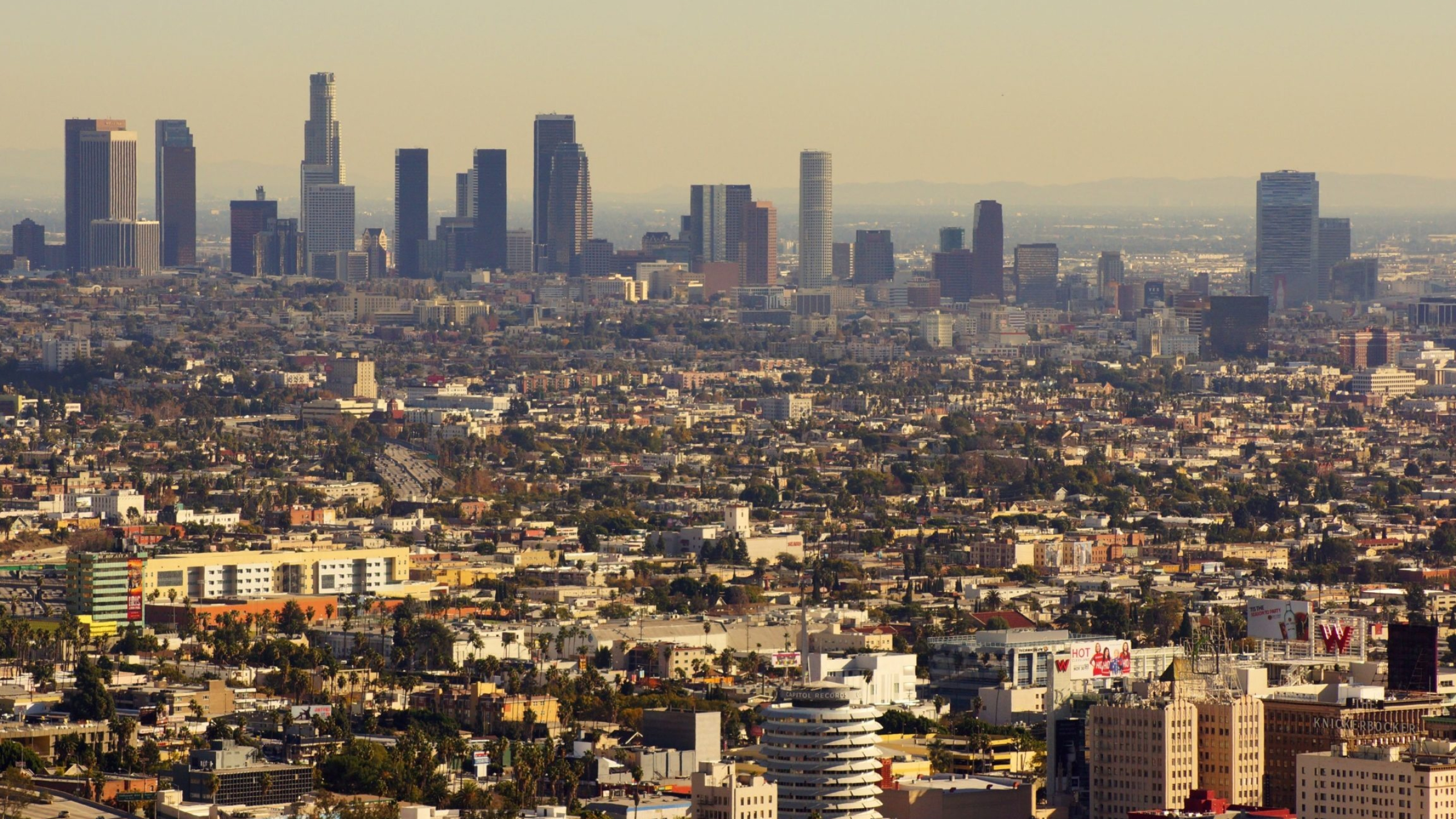 Los Angeles: An important center of culture, medicine, agriculture, business, finance, energy, aerospace, science, food processing, media, international trade, and tourism, LA. 2560x1440 HD Background.