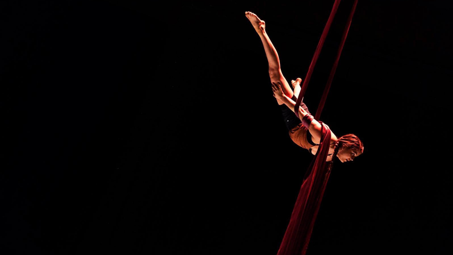 Aerial Silks: An amazing circus performance by a professional gymnast flying in the air. 1920x1080 Full HD Wallpaper.