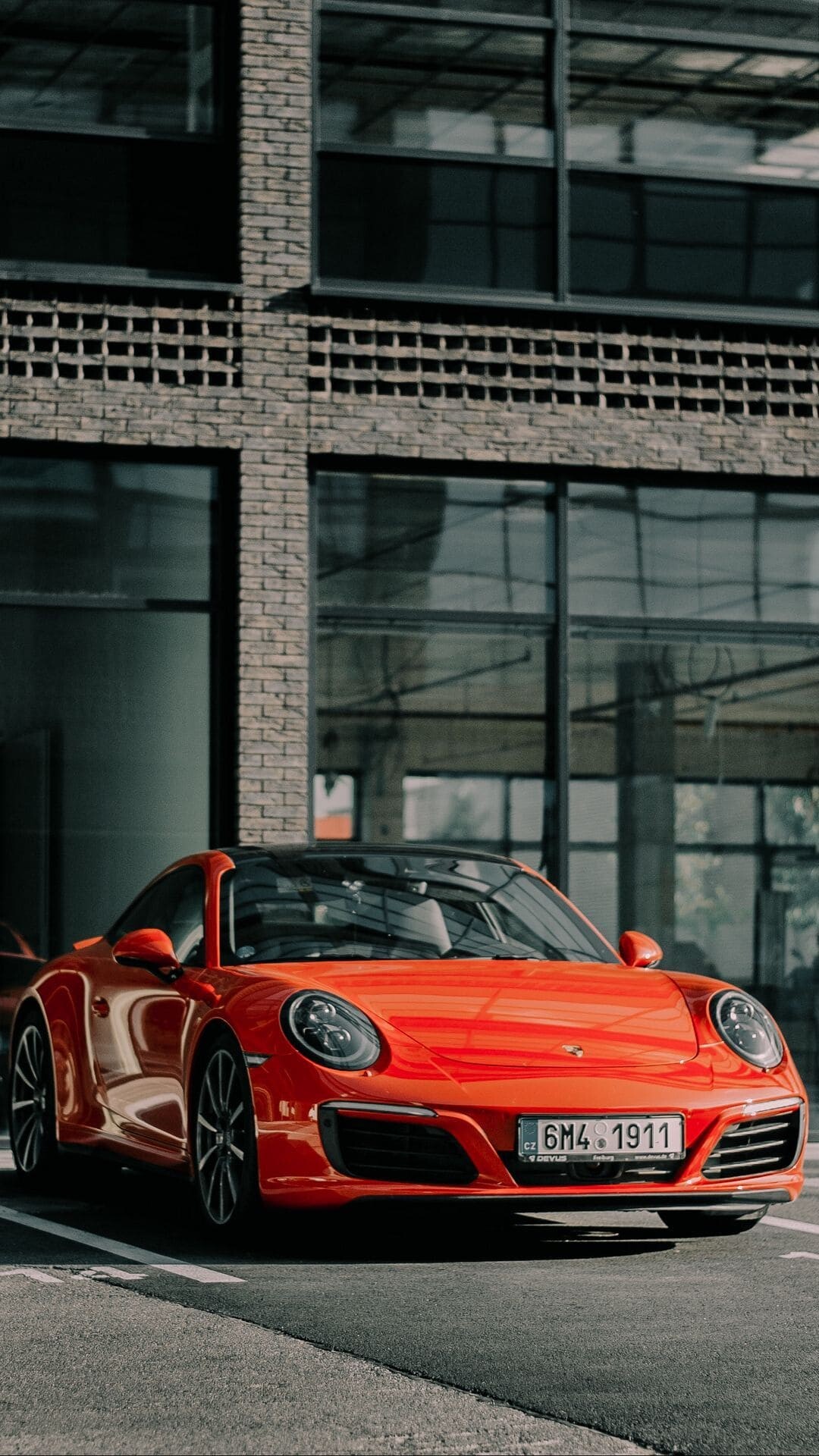 Porsche: A reputed German automobile manufacturer that specializes in producing high-end sports cars, sedans, and SUVs. 1080x1920 Full HD Background.