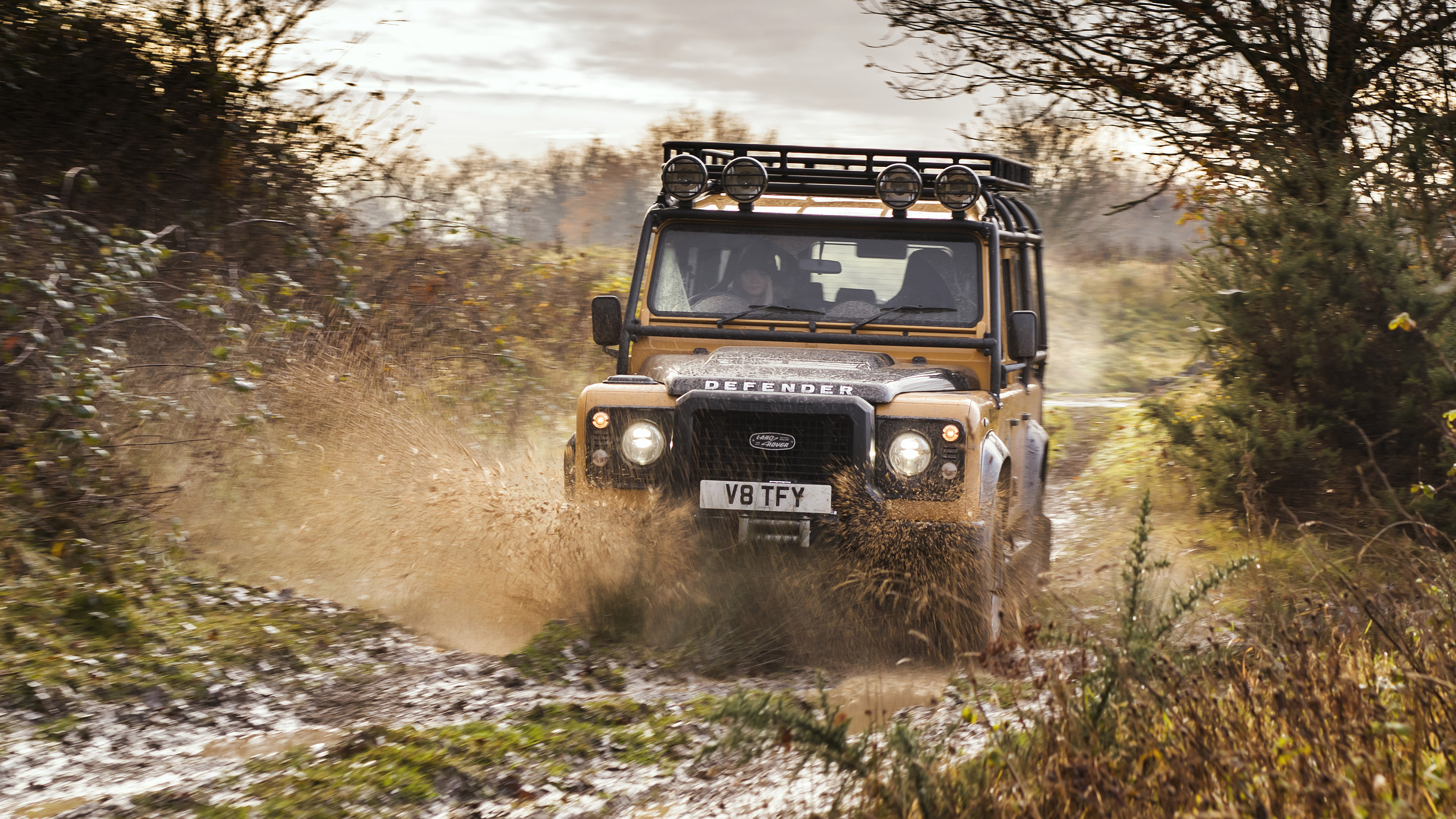 Off-road Driving: Land Rover Defender, Mudding, Off-roading through an area of wet mud or clay. 3840x2160 4K Wallpaper.
