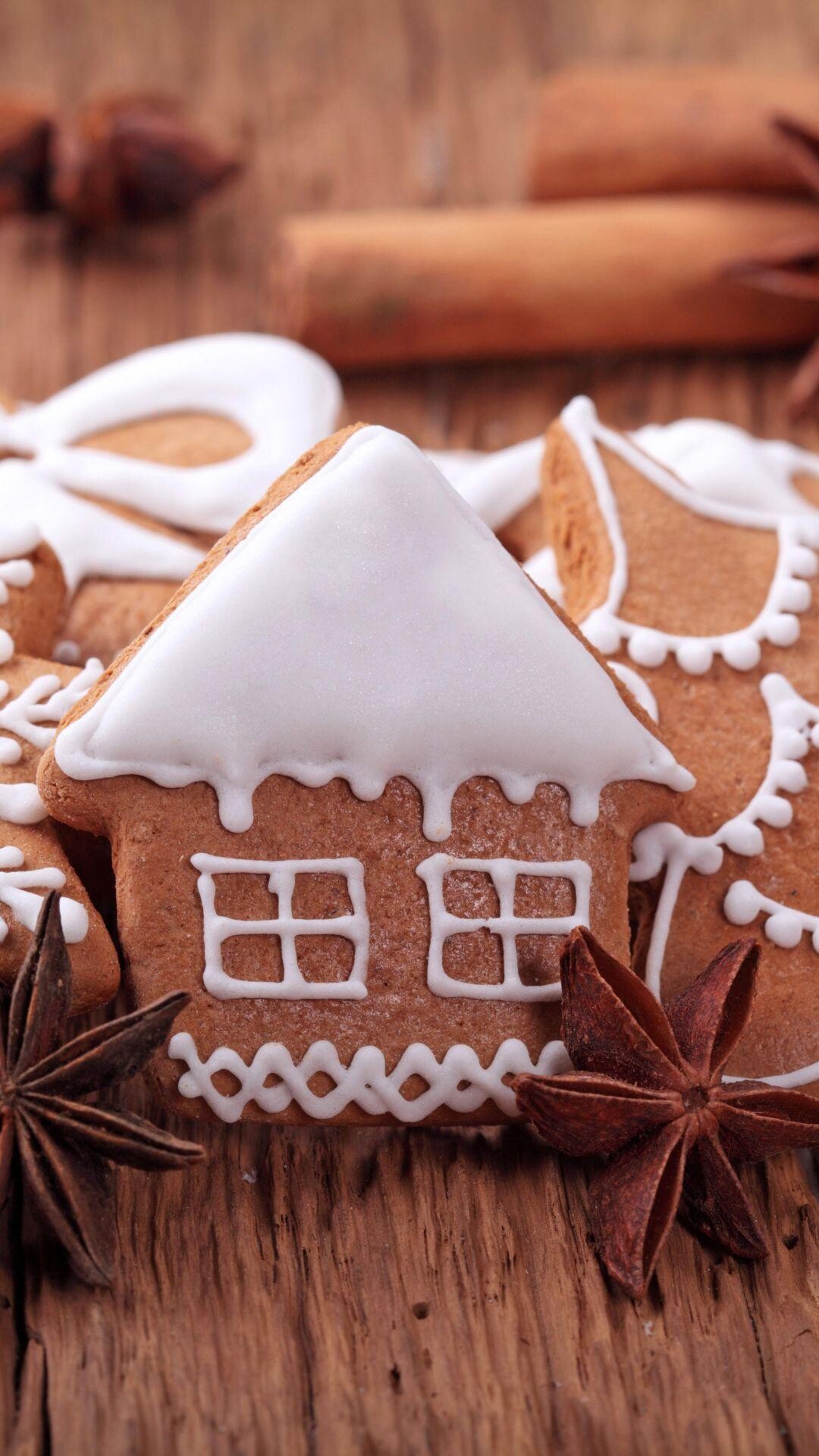 Gingerbread House: Gingersnap cookies, Variety of shapes, Christmas bakery, A charming and sweet tradition. 1080x1920 Full HD Wallpaper.
