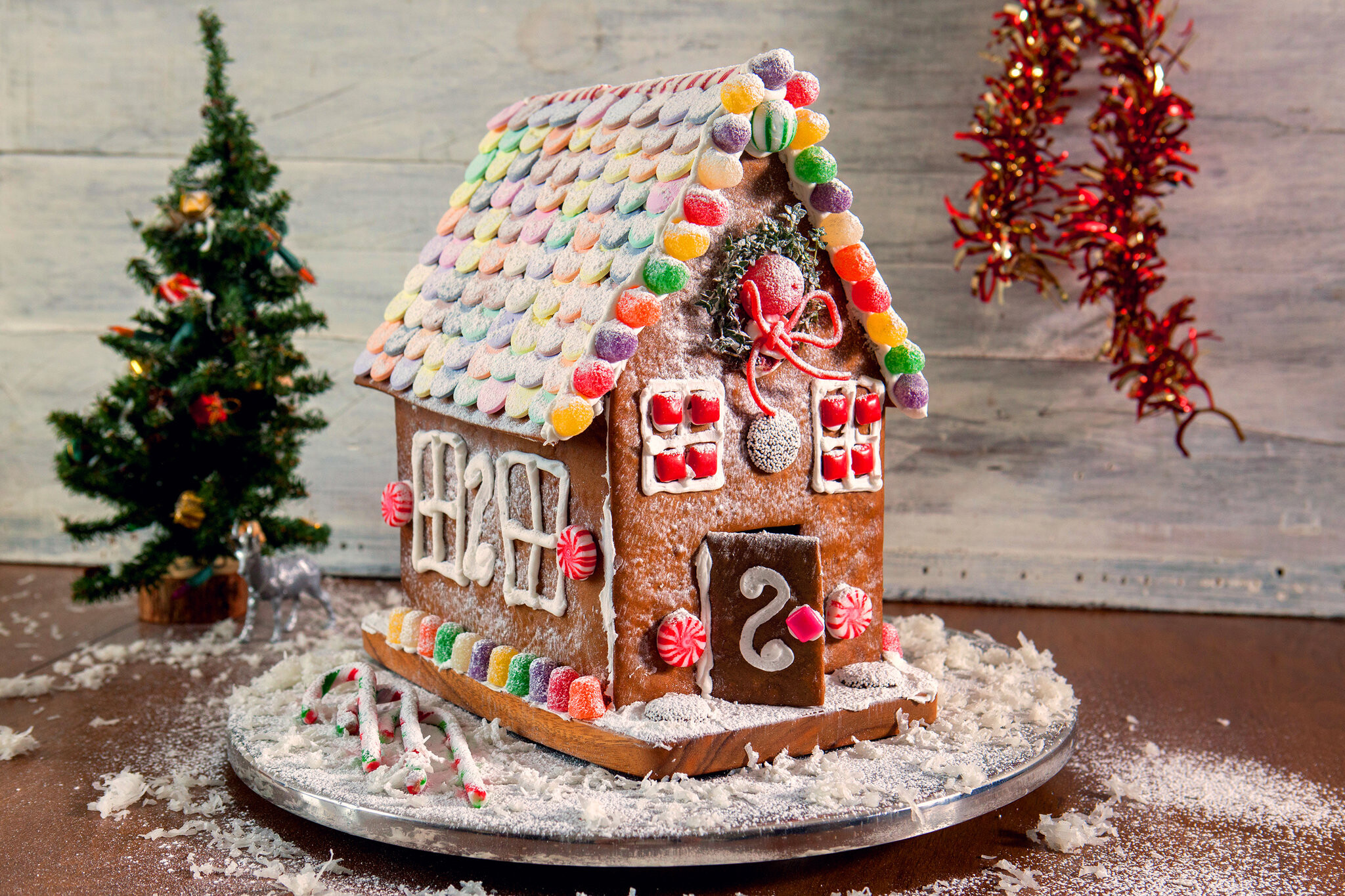 Gingerbread House: Cookie house, Peppermint swirl candies, Candy canes, Dough for gingerbread construction projects. 2050x1370 HD Wallpaper.
