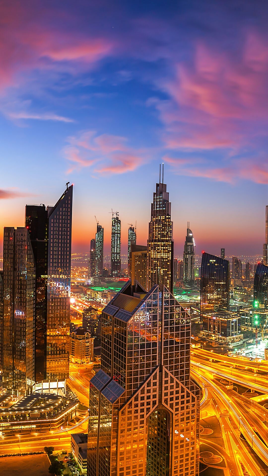 United Arab Emirates: A federation of seven states formed in 1971, Dubai urban skyline at sunset. 1080x1920 Full HD Background.