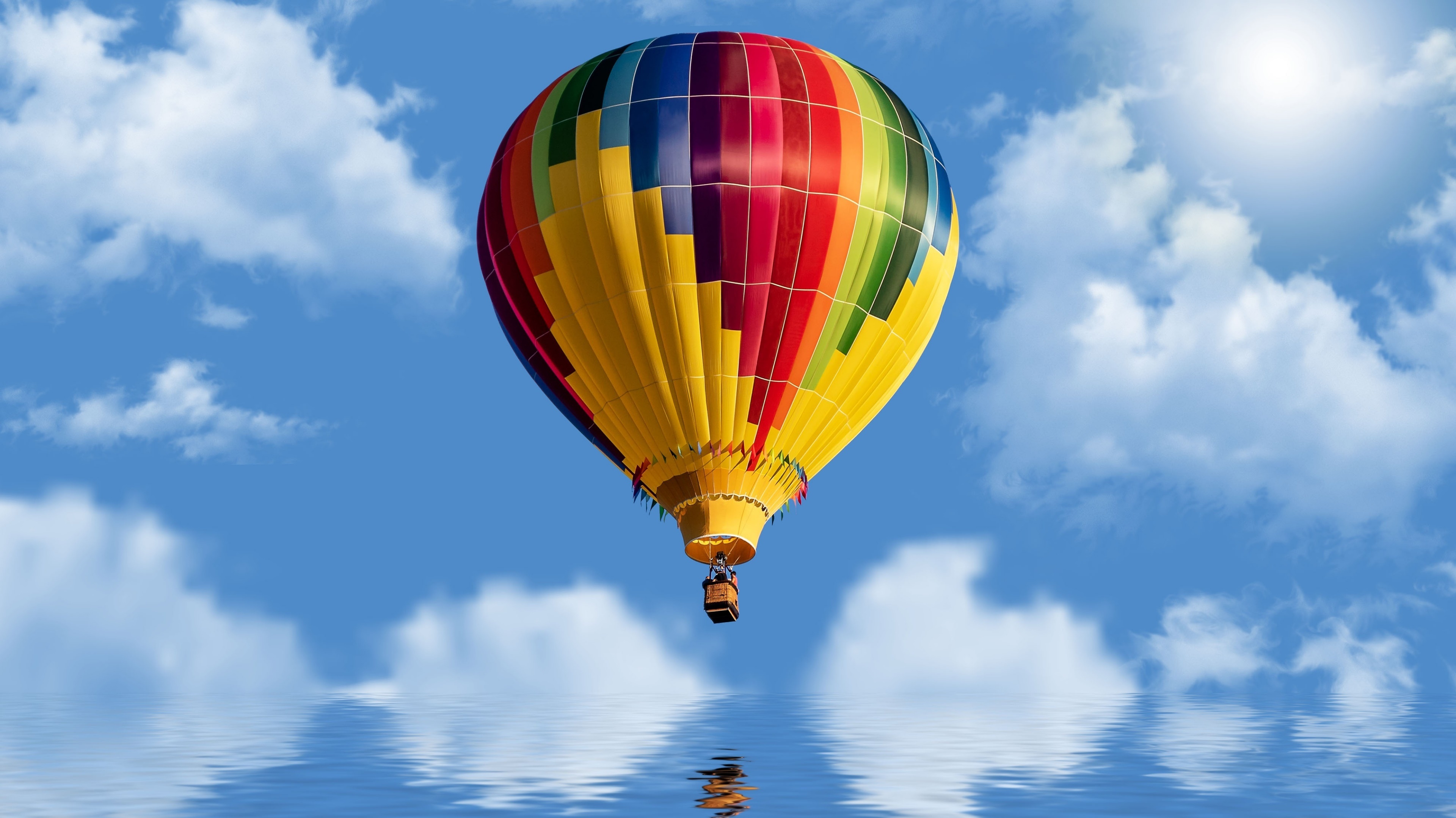 Hot Air Balloon: Aeronautics, Heated Air, Multi-Colored Envelope Carrying a Basket. 3840x2160 4K Background.