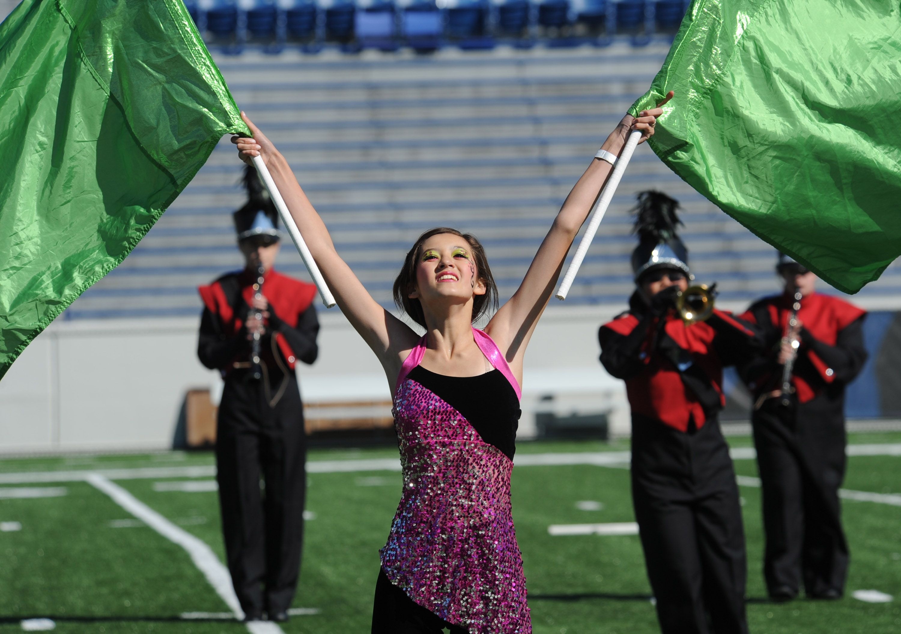 Color Guard (Flag Spinning): Winter guard, Marching band show, Football halftime. 3000x2110 HD Background.