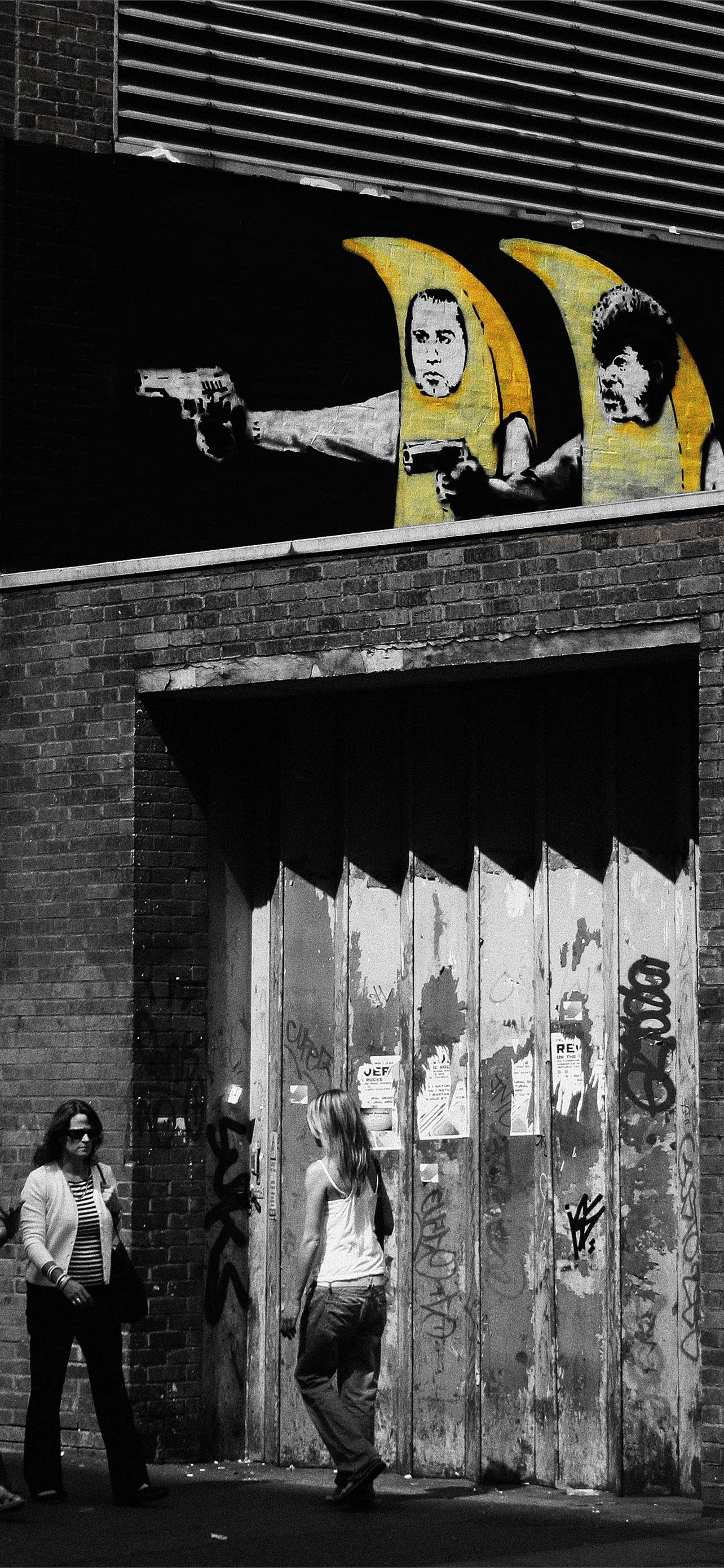 Banksy: He has worked in many street art mediums and in many styles, breaking down the boundaries and expectations of street art critics. 1290x2780 HD Background.