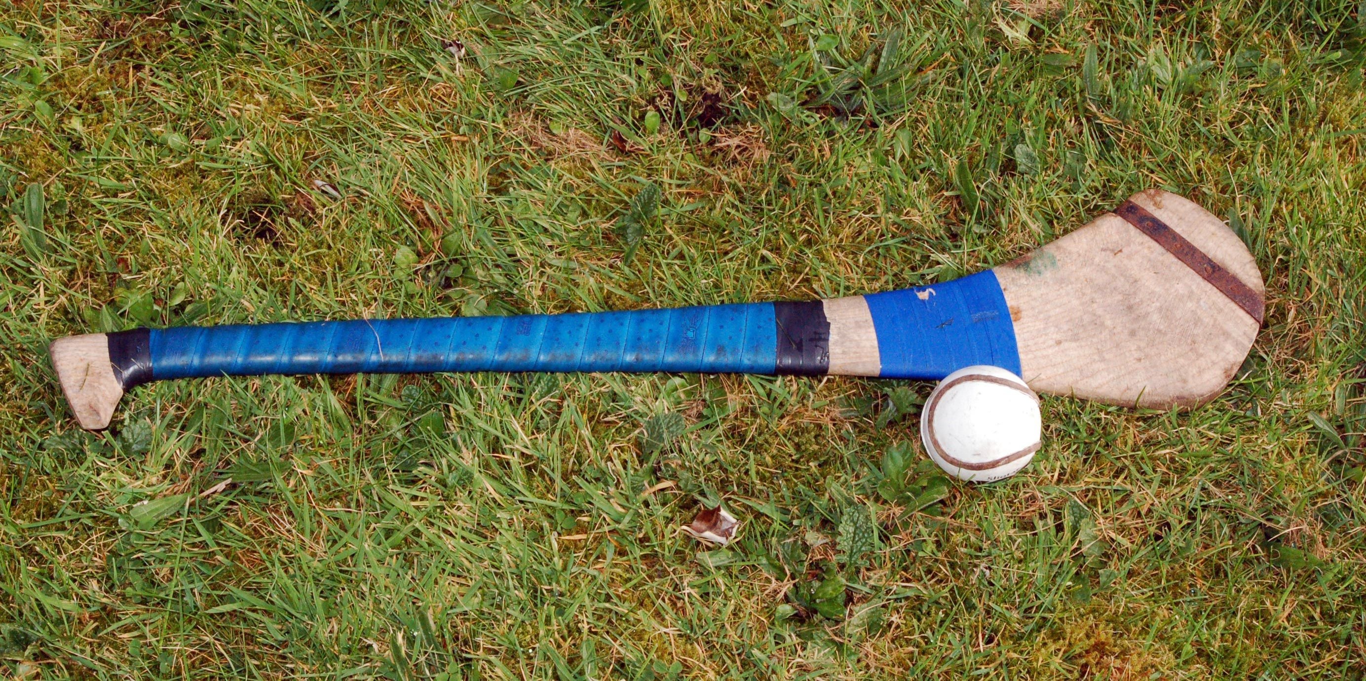 Hurling: An ash wood stick called a hurley and a small ball called a sliotar. 2770x1380 Dual Screen Background.