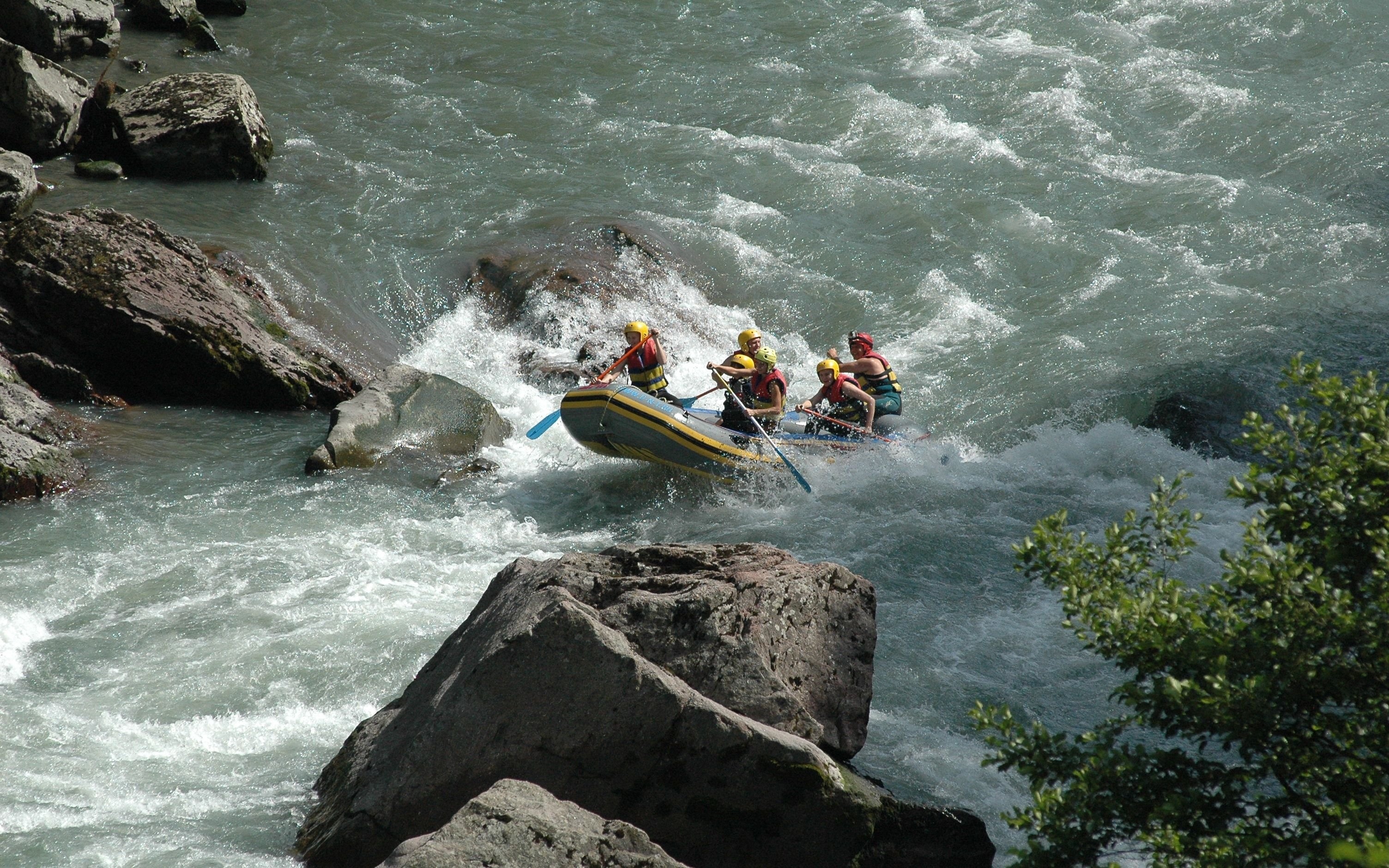 Rafting: Class 3-4 whitewater difficulty, Medium waves, rocks and a considerable drop. 3010x1880 HD Background.