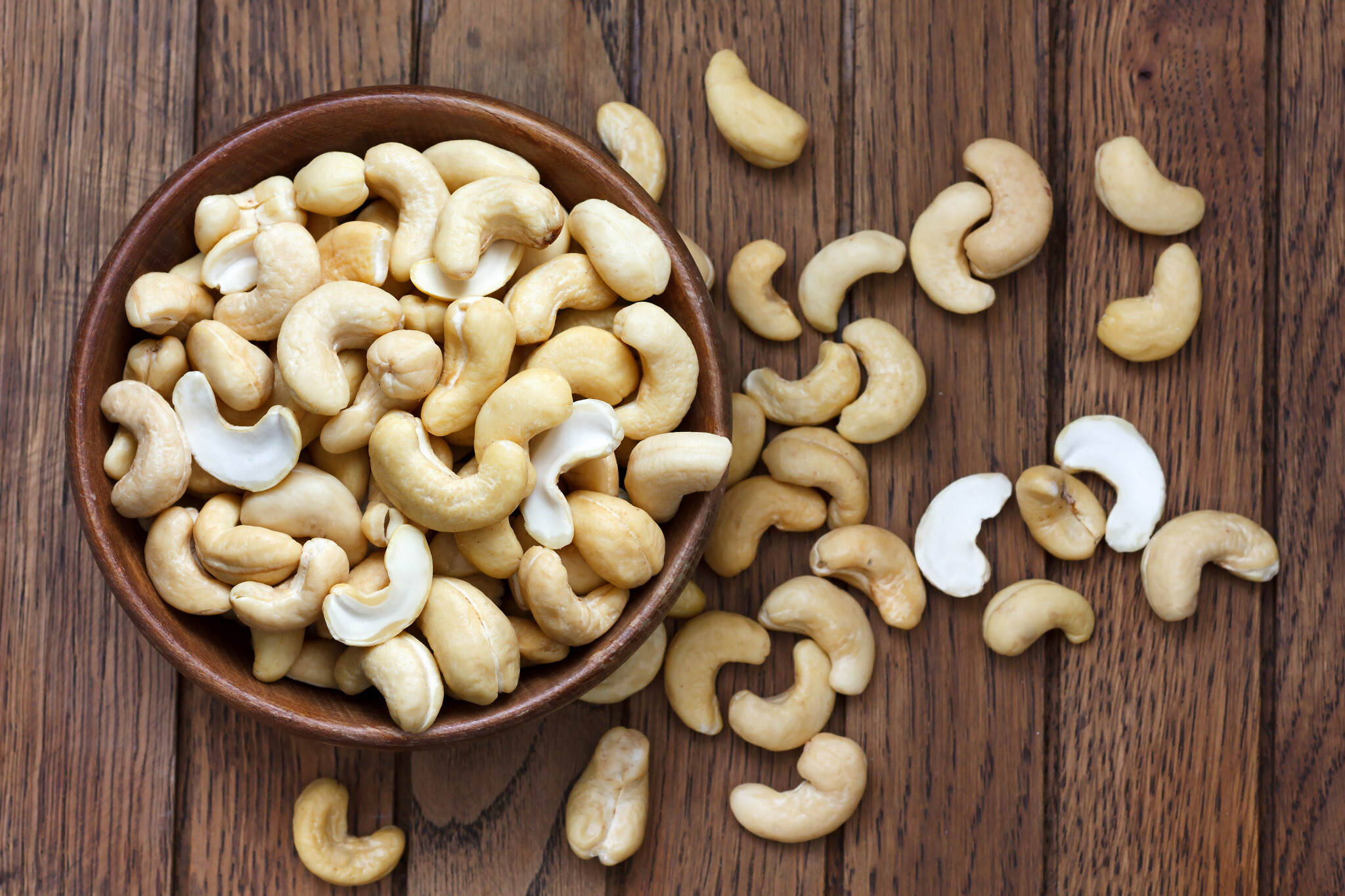 Cashew Nuts: Cultivated in warm, humid climates across the globe: Vietnam, Nigeria, India, Brazil, and Indonesia. 2050x1370 HD Background.