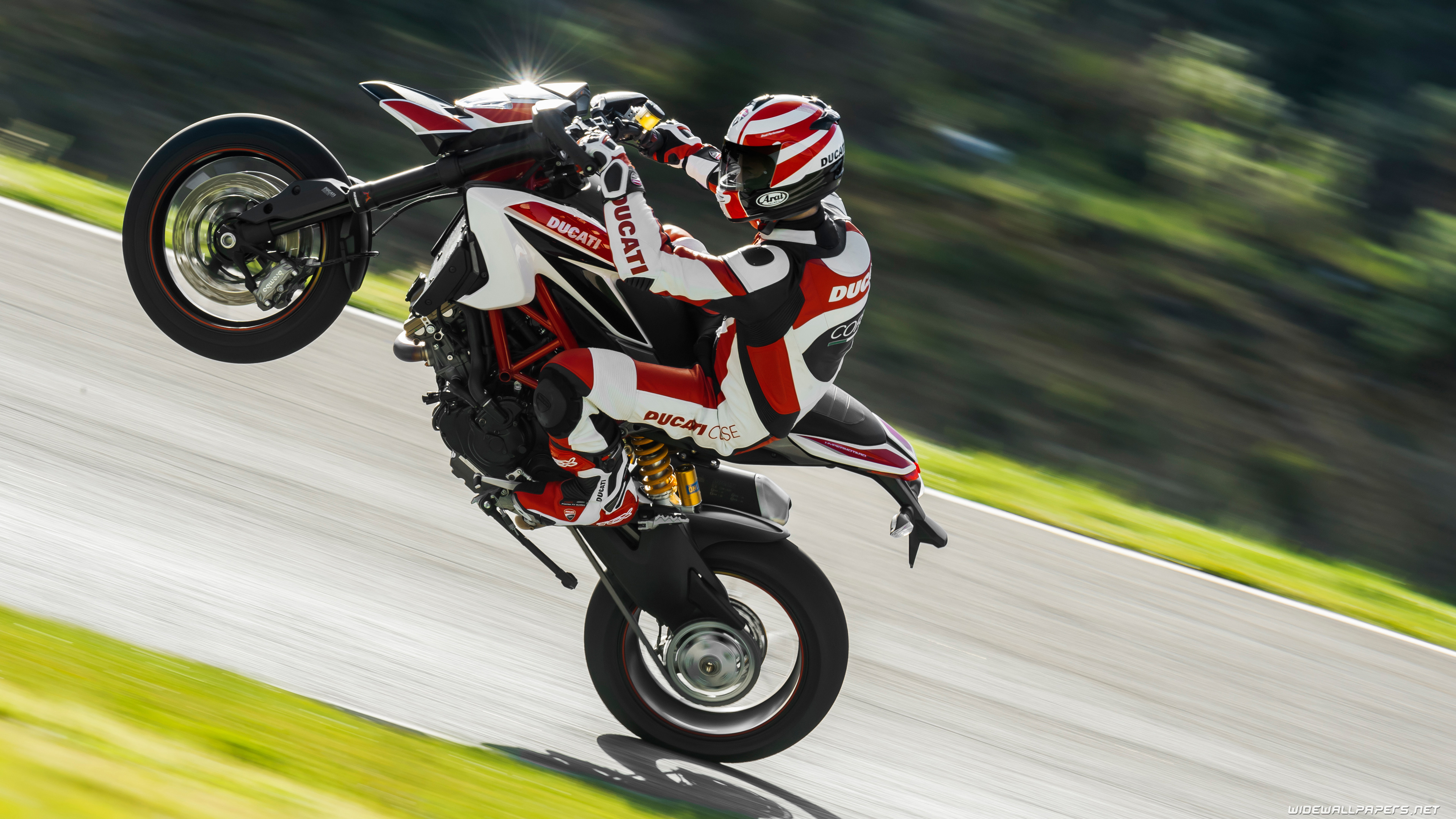 Stunt: Ducati Hypermotard motorcycle, Stuntman doing wheelstand. 3840x2160 4K Background.