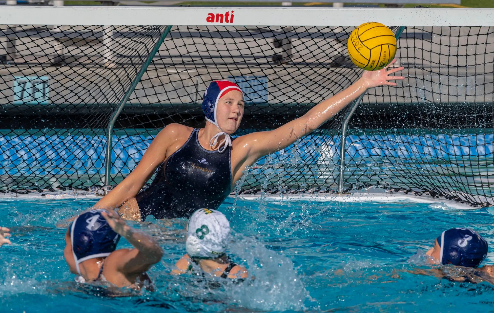 Water Polo: Yucaipa goalkeeper Christine Carpenter blocks a shot on goal during the CIF-SS Division 2 match. 2000x1270 HD Background.