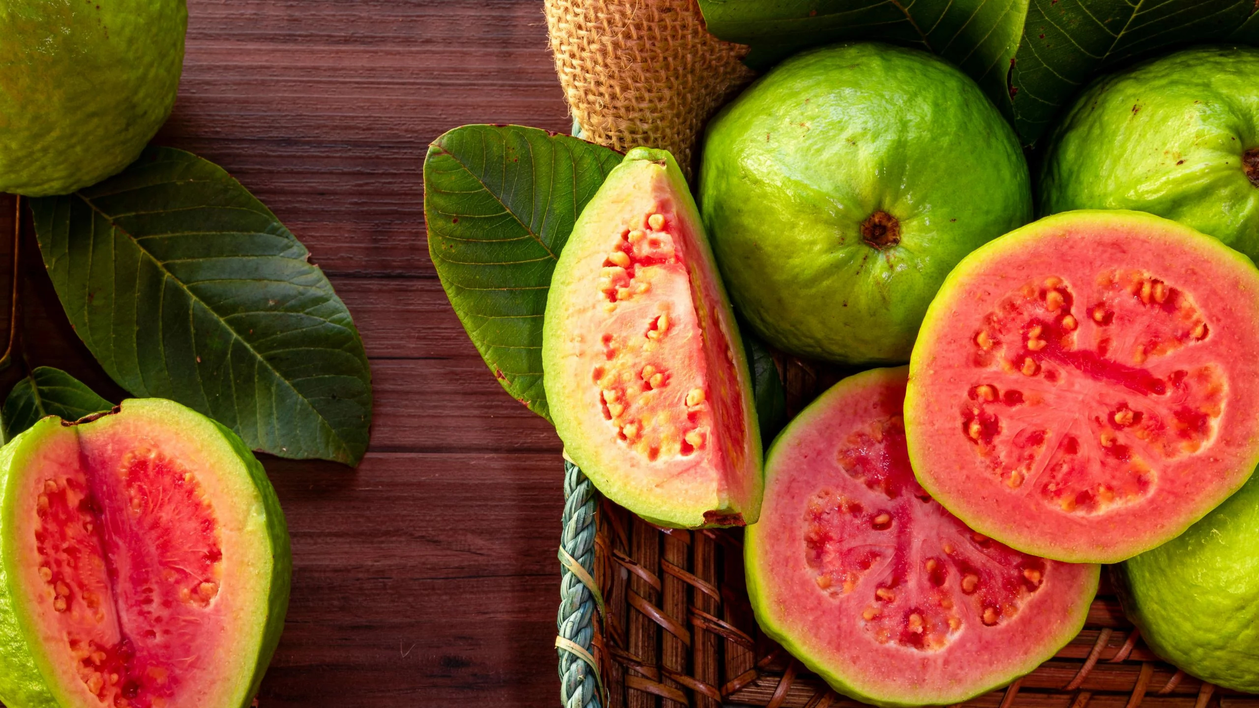 Guava: The sweet fruit of the tree, which grows in tropical regions of America and Asia. 2560x1440 HD Background.