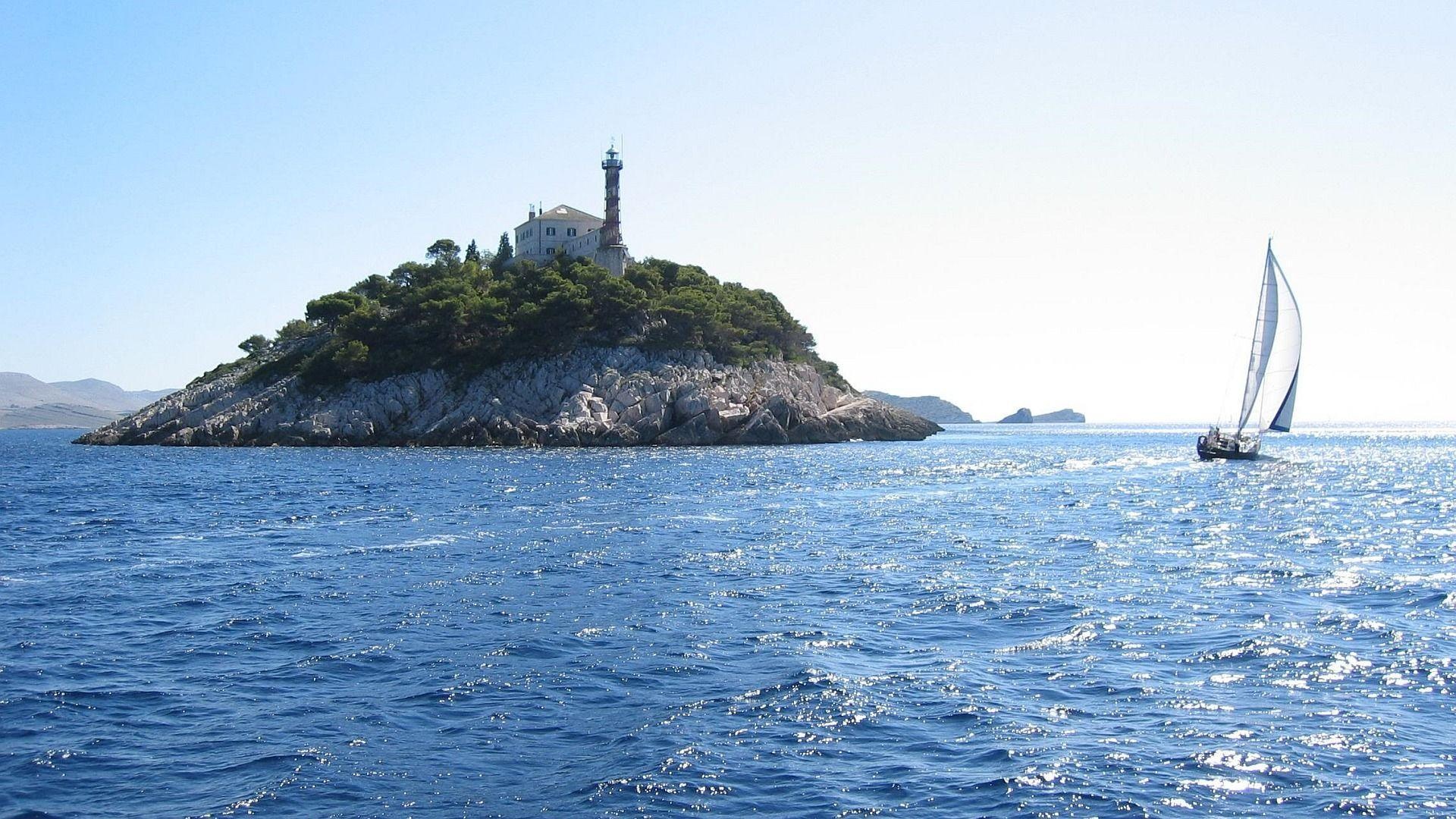 Croatia: The islet of Sestrica Vela, Lighthouse build in 1871. 1920x1080 Full HD Background.