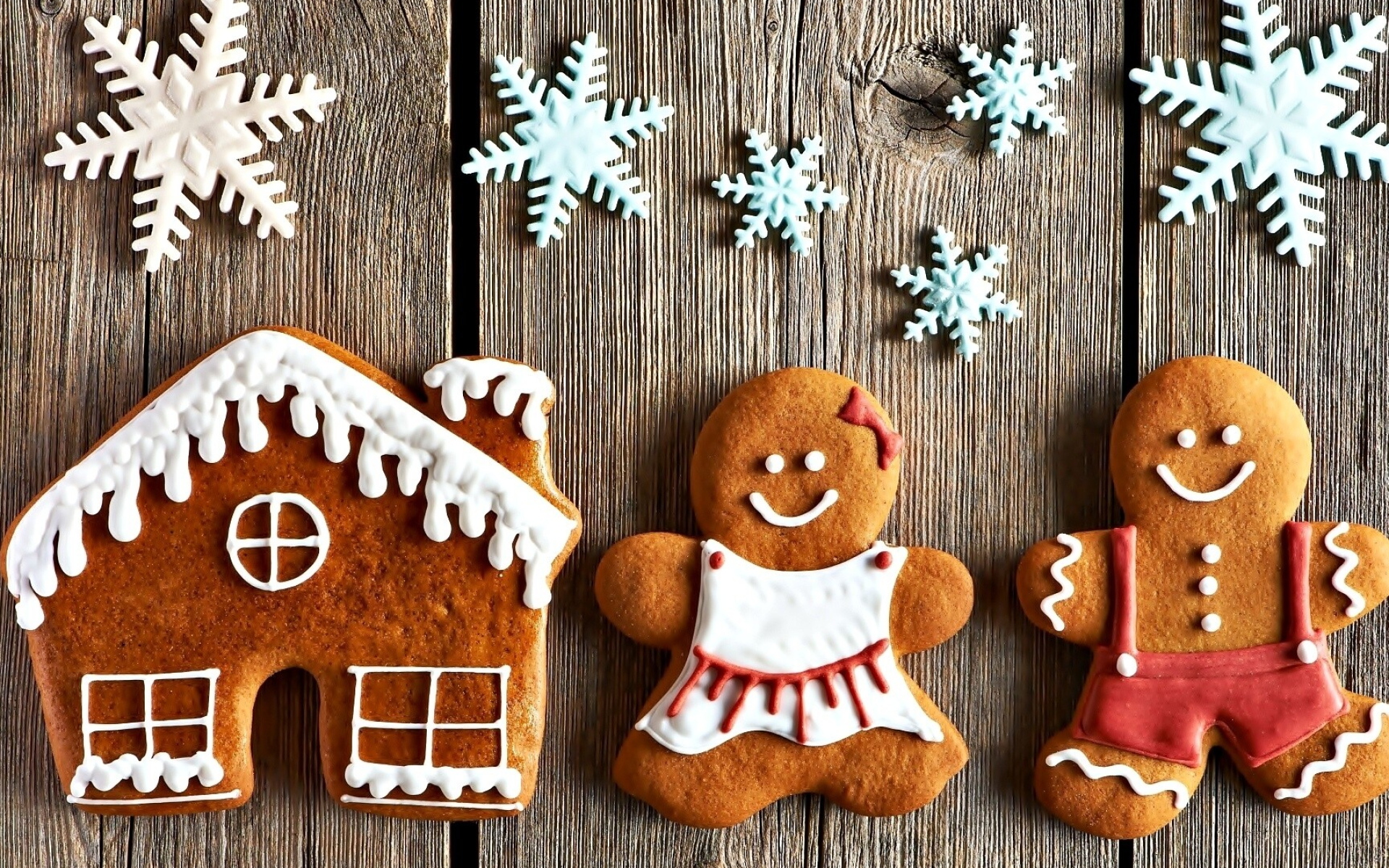 Gingerbread House: Classic ginger cookies baked in cinnamon sugar, Intricately piped icing decorations, Snowflakes. 1920x1200 HD Background.