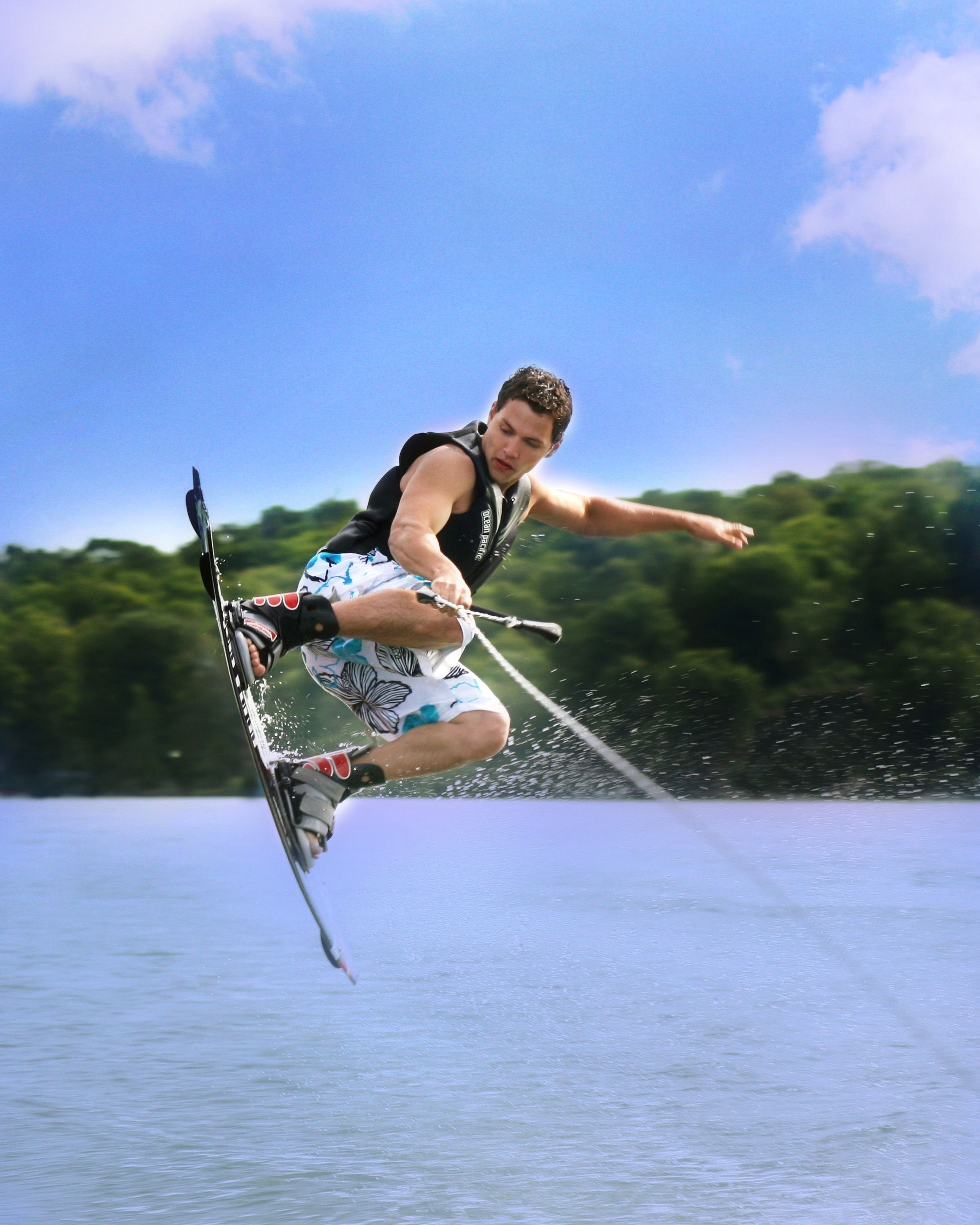 Wakeboarding: Aerial maneuvers during riding a wakeboard towed behind a motorboat. 1970x2460 HD Wallpaper.